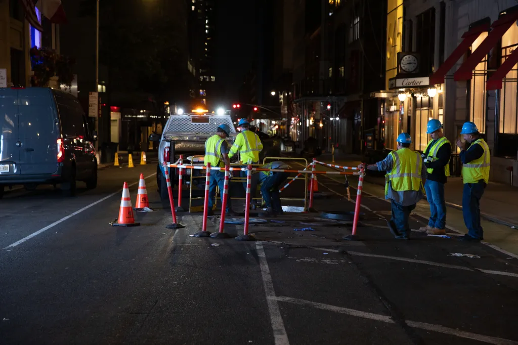 Con Ed workers repair a manhole cover at 52nd St. and 5th Ave. in Manhattan, Tiuesday, May 19, 2026.
