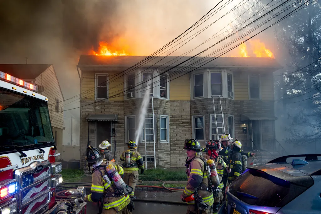 Firefighters battling a 10-alarm fire at a two-story home in Belleville, NJ.