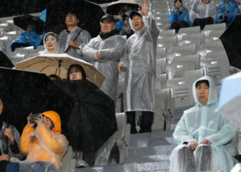 The South Koreans Cheering for a Visiting North Korean Soccer Team