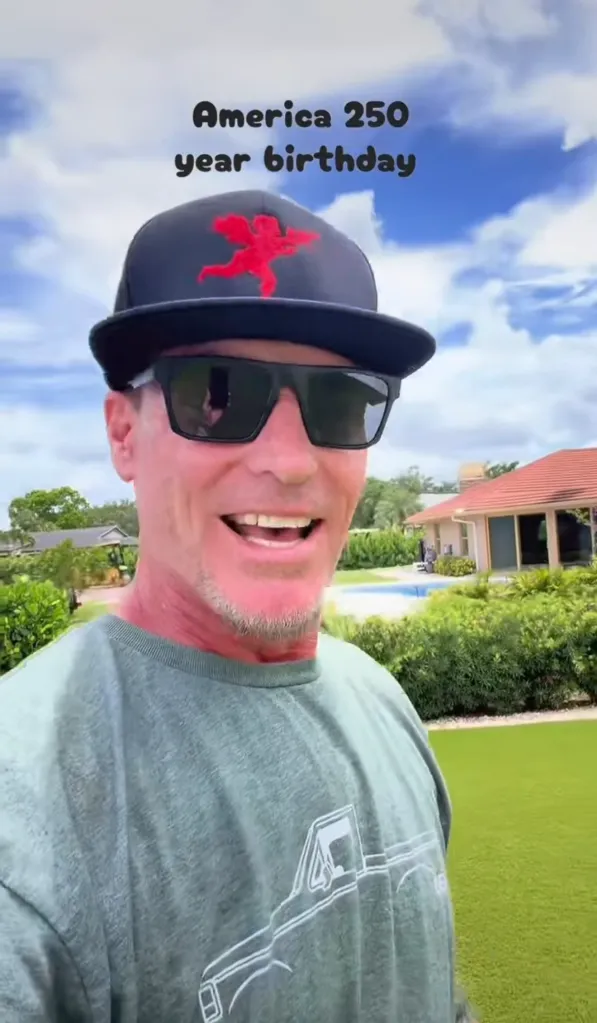 Vanilla Ice in a black cap and sunglasses, smiling for a selfie video with 