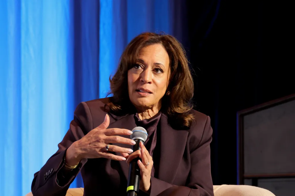 Kamala Harris speaking into a microphone at the 2026 Power100 Honoree Dinner.