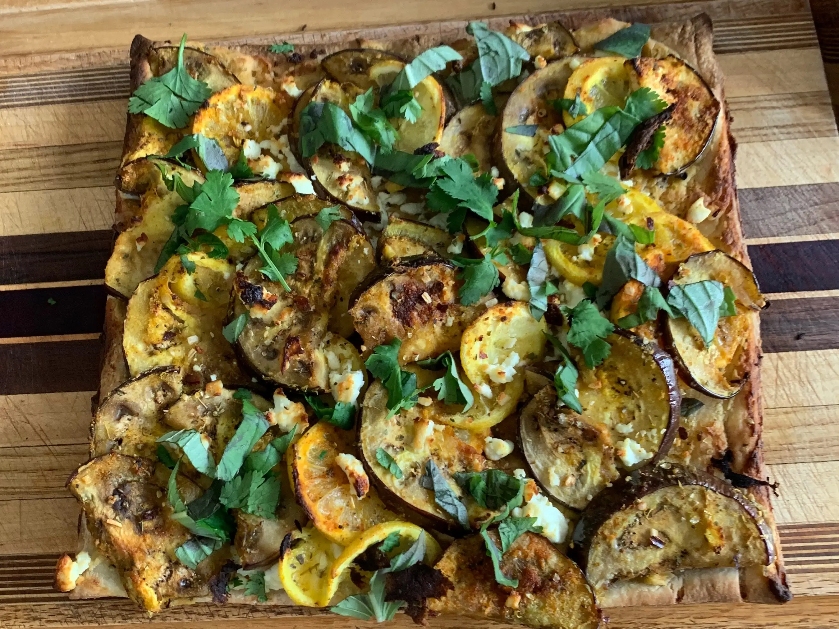 EGGPLANT LEMON TART on cutting board