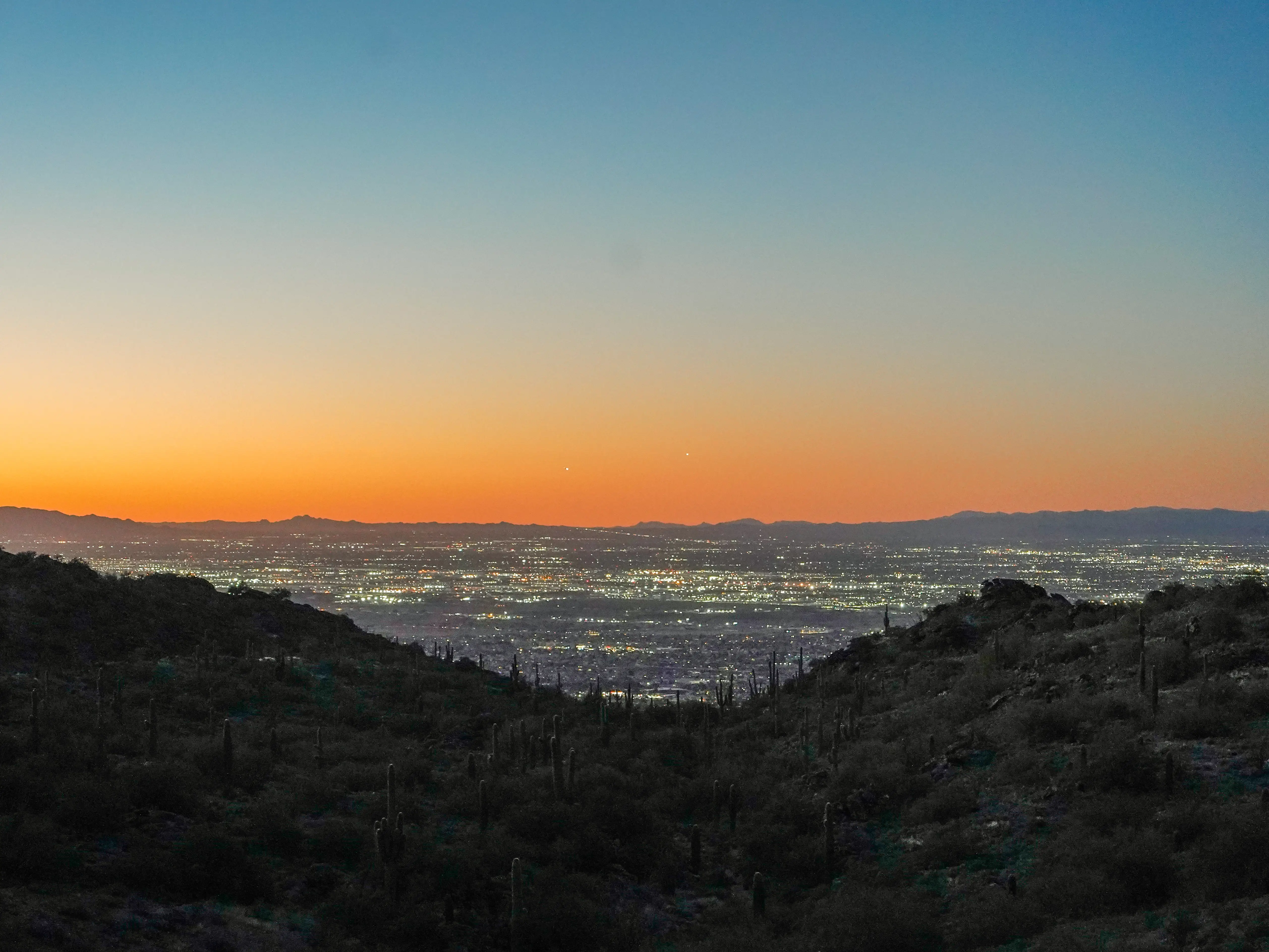 The sun sets over Phoenix in the mountains
