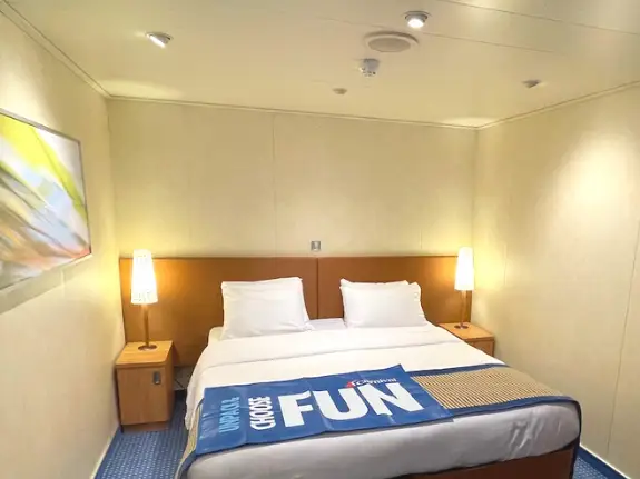 A interior shot of the cruise ship cabin and a selfie in front of the cruise ship shot.