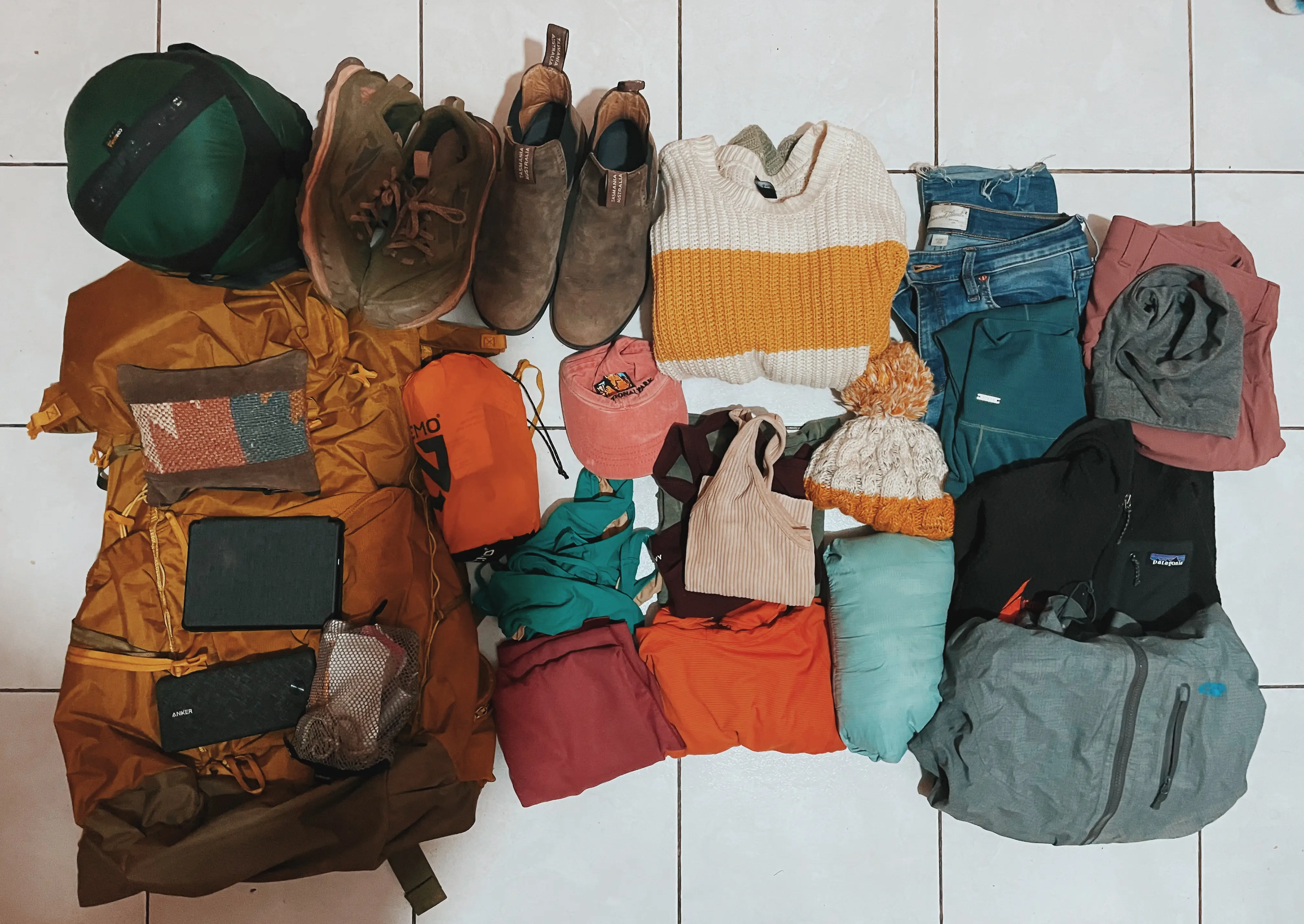 clothes laid out on white table, what nicole jones packs