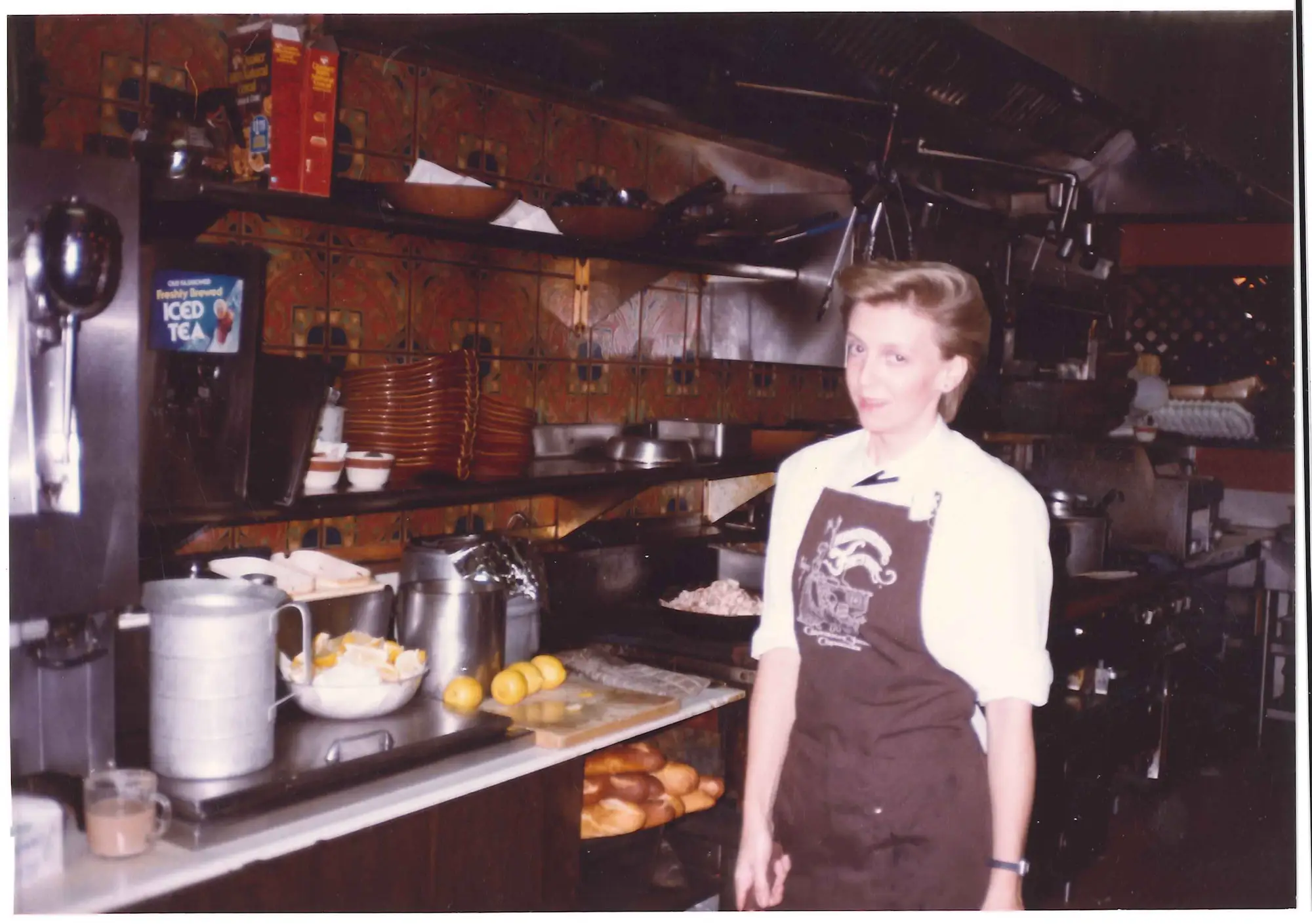 Mary D'Astugues – Old BH server uniform pic – Early on, the Beverly Hills restaurant staff wore café aprons over their uniforms. Pictured here is original Beverly Hills staff member/ server Mary D'Astugues