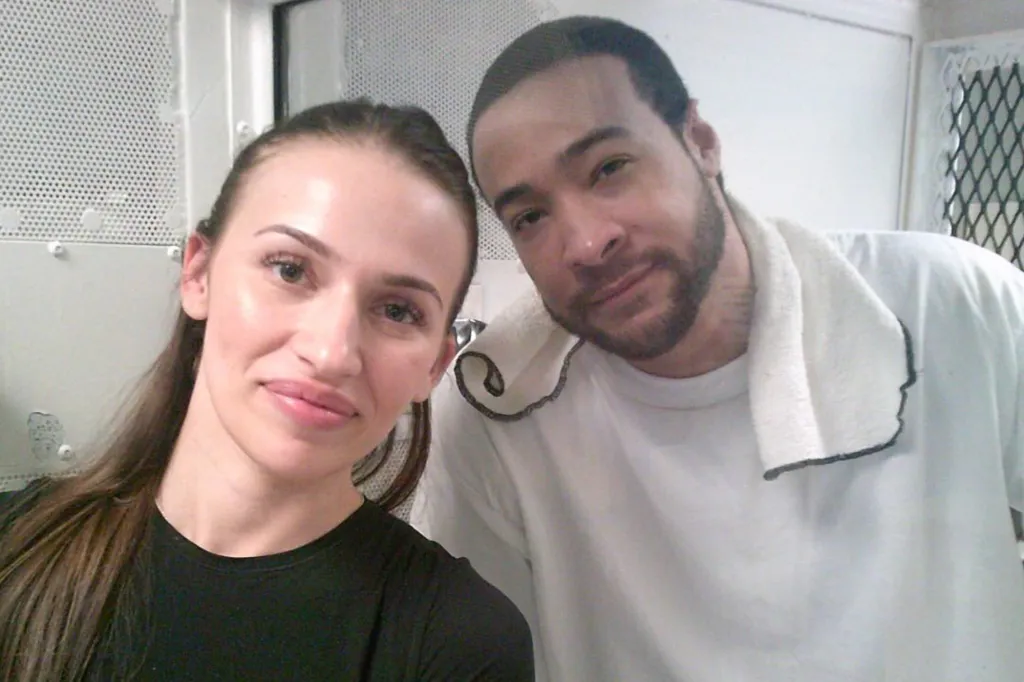 A woman with long brown hair and a man with a beard stand next to each other.