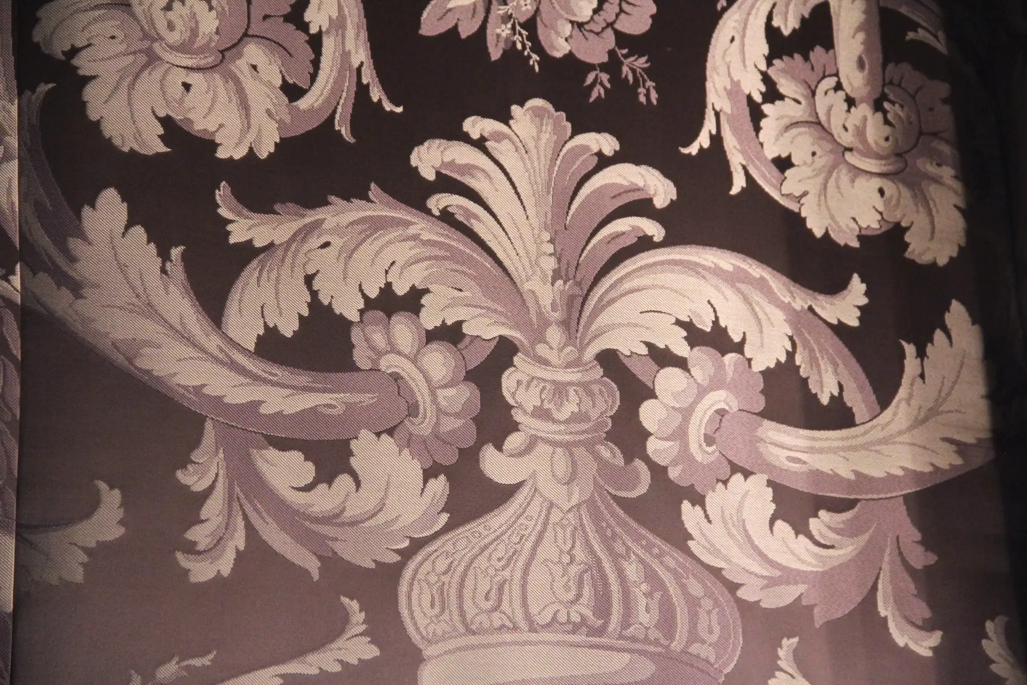 A close-up of Alva Vanderbilt's purple wallpaper at Marble House.