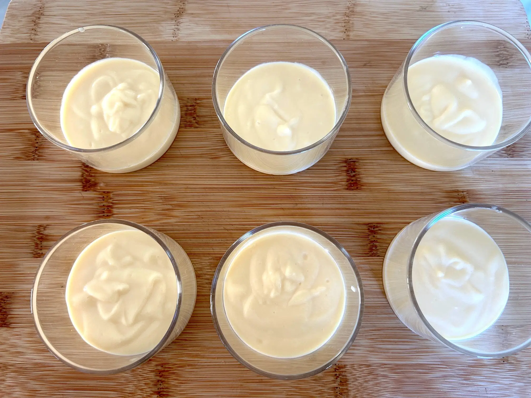 Adding pudding to dessert cups for Meghan Markle's Chantilly Lily