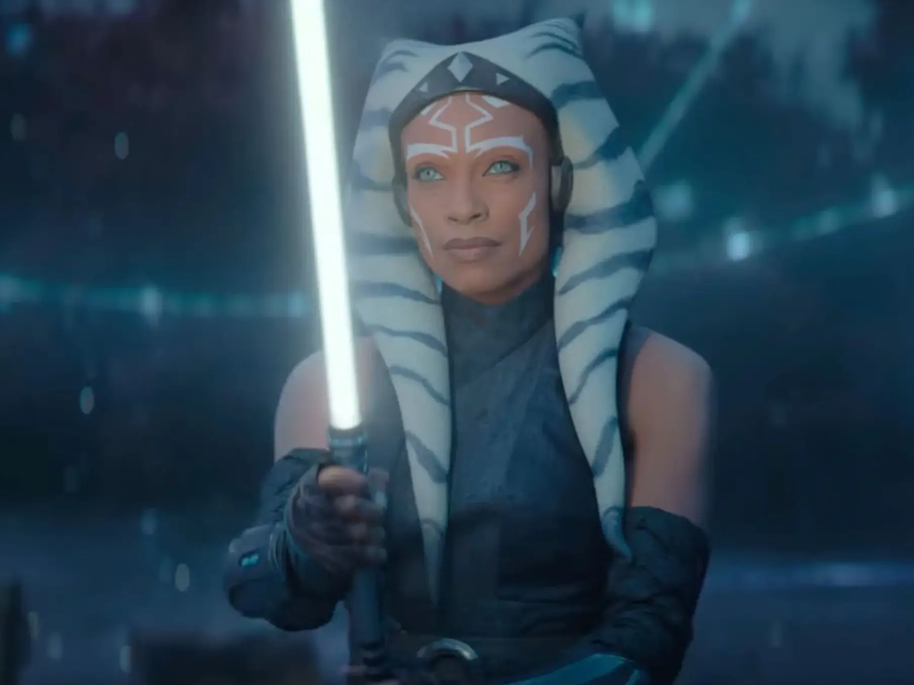 Rosario Dawson as Ahsoka Tano holding a lightsaber in 