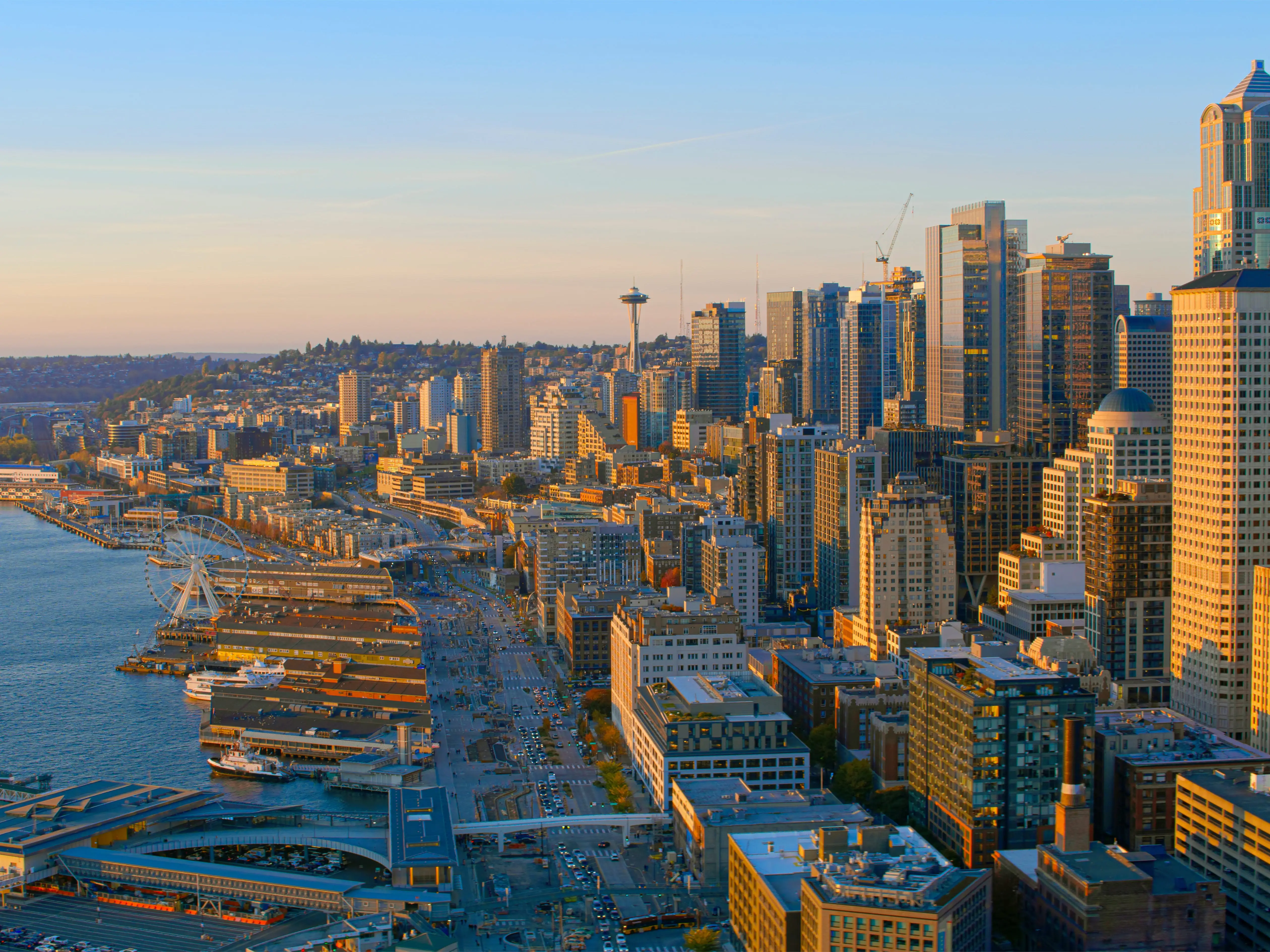 An aerial view of the Seattle skyline meeting the coast.