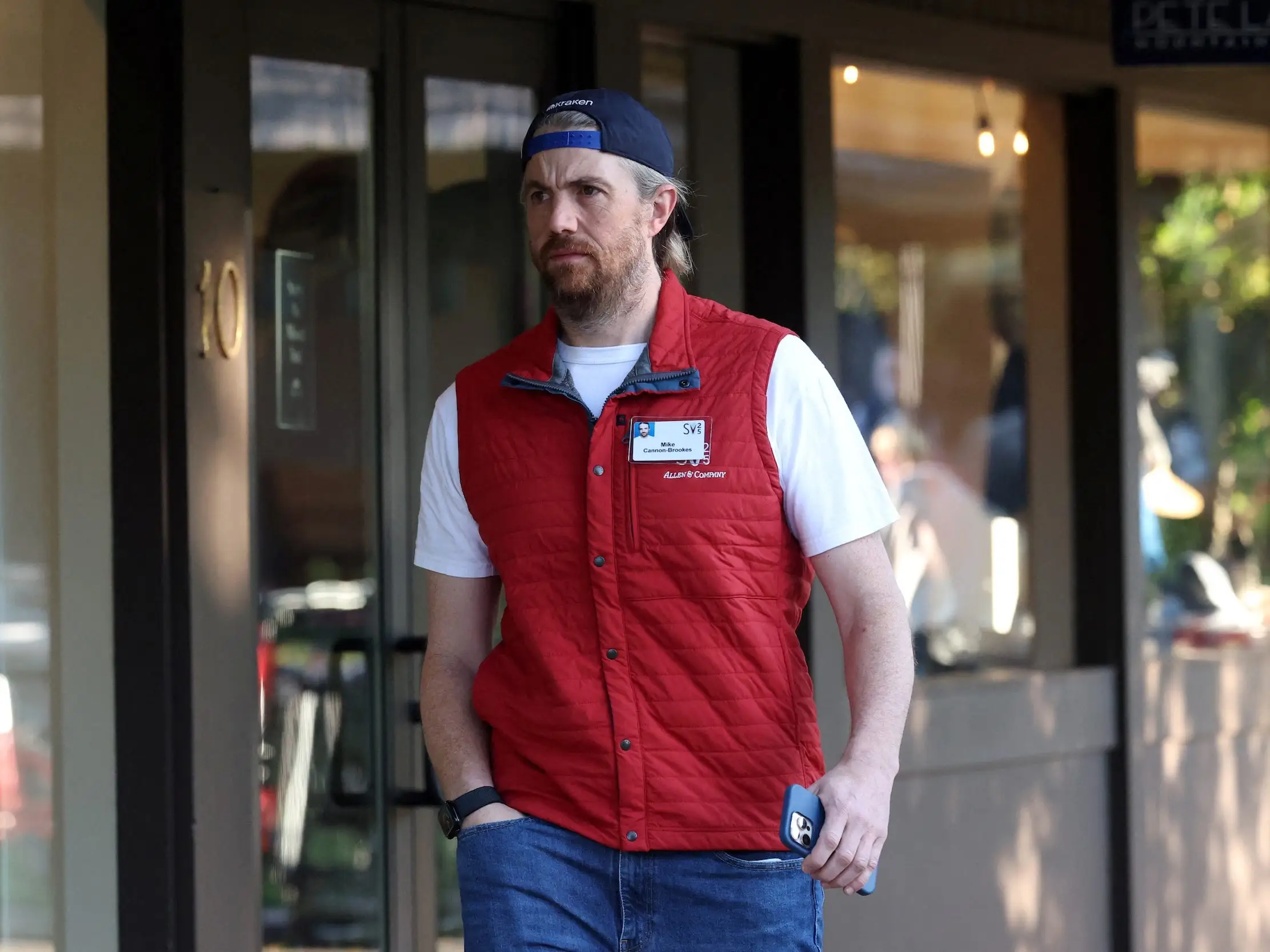Mike Cannon-Brookes walks around during the annual media and tech conference in Sun Valley
