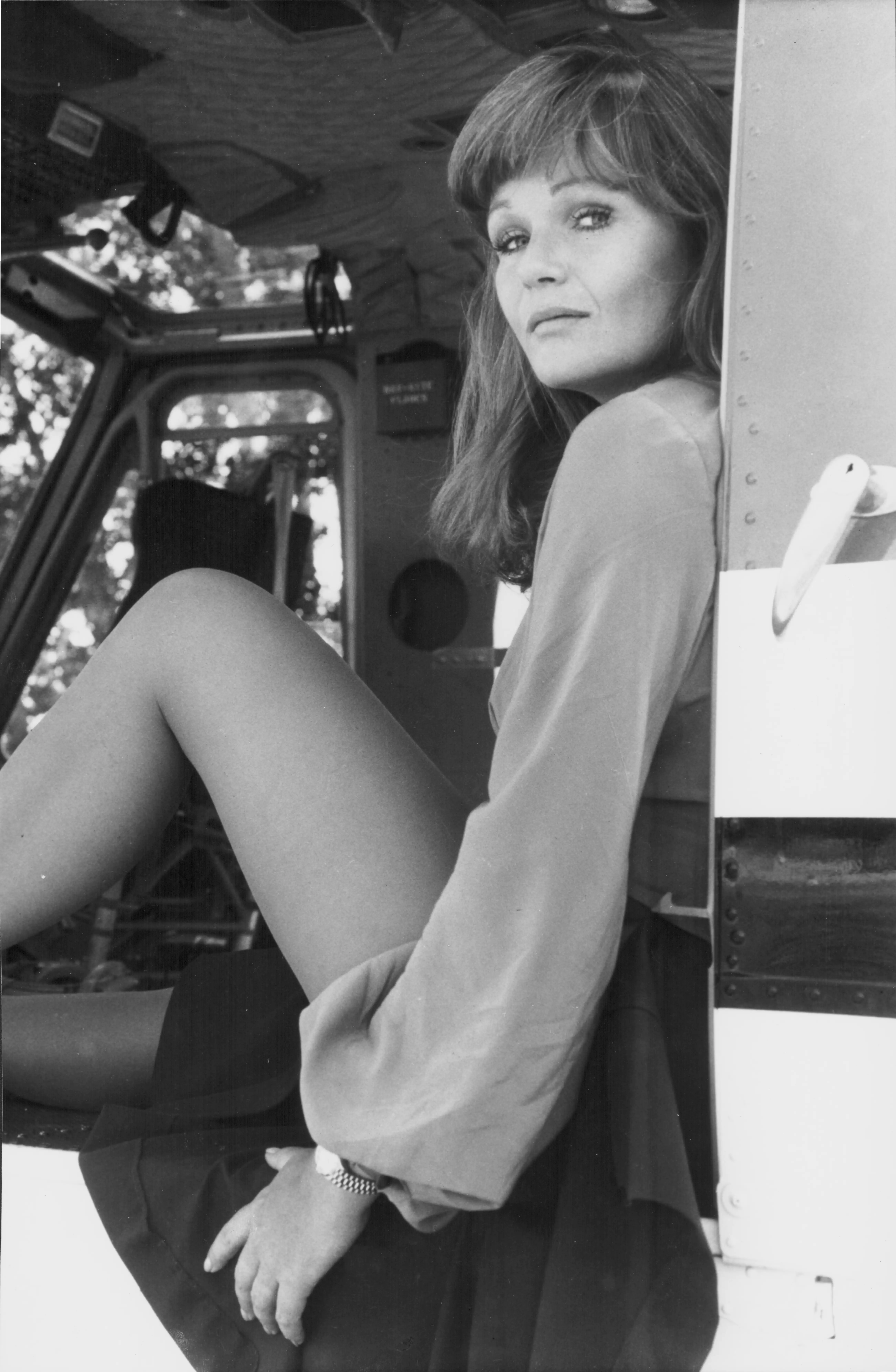 Valerie Perrine sitting in a truck