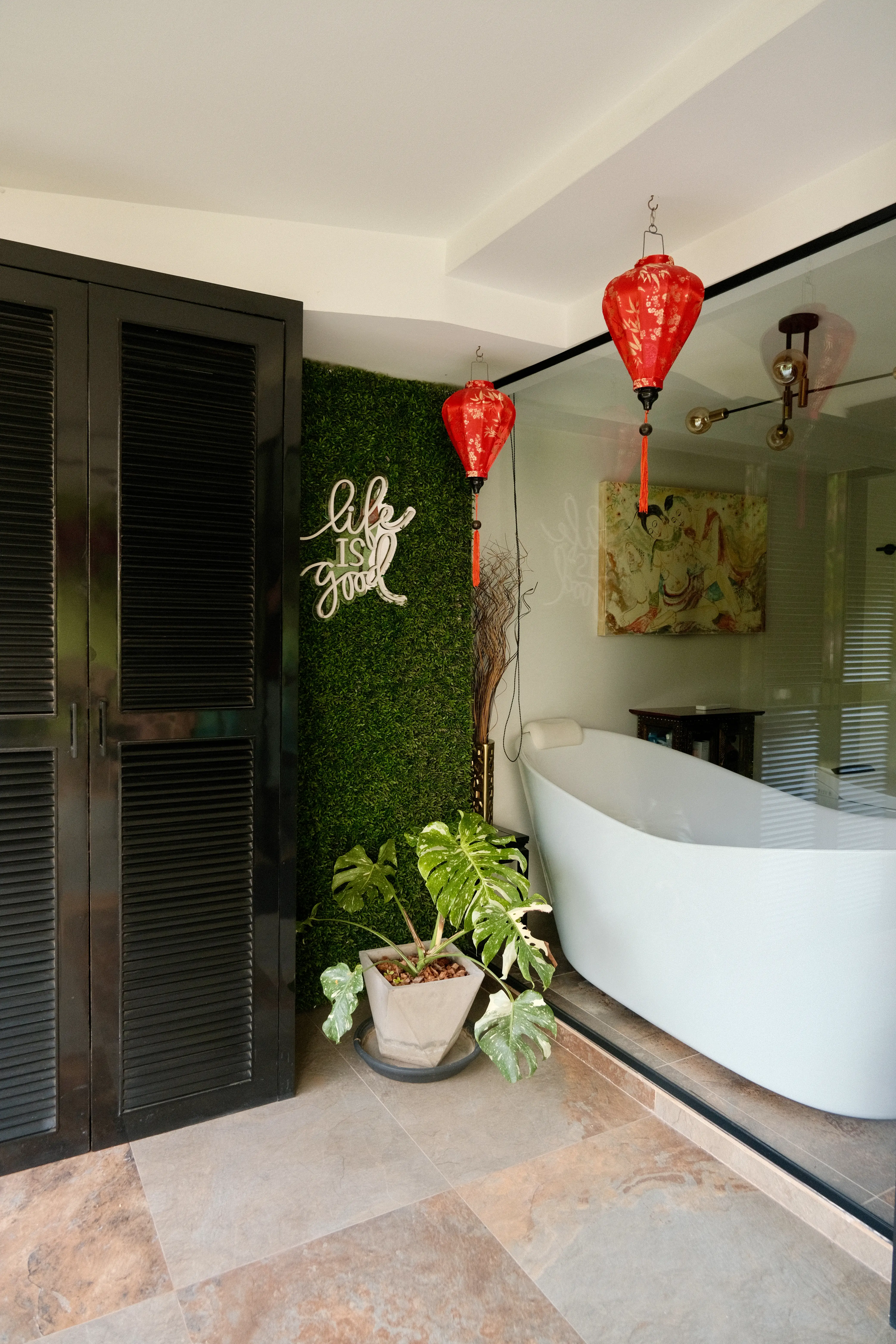 The master bathroom with a bathtub overlooking the balcony.