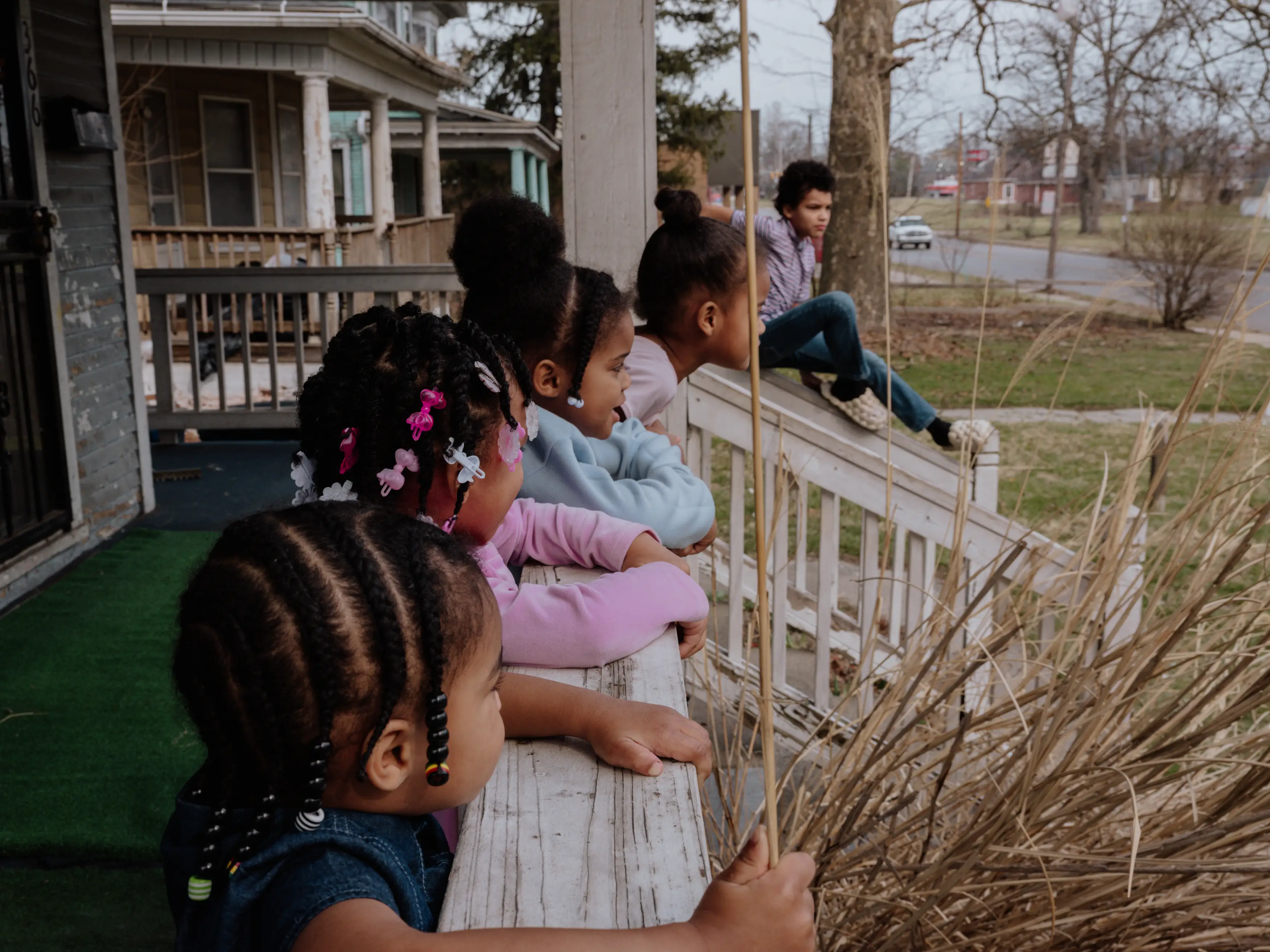 June Boyd's grandkids lon the front porch