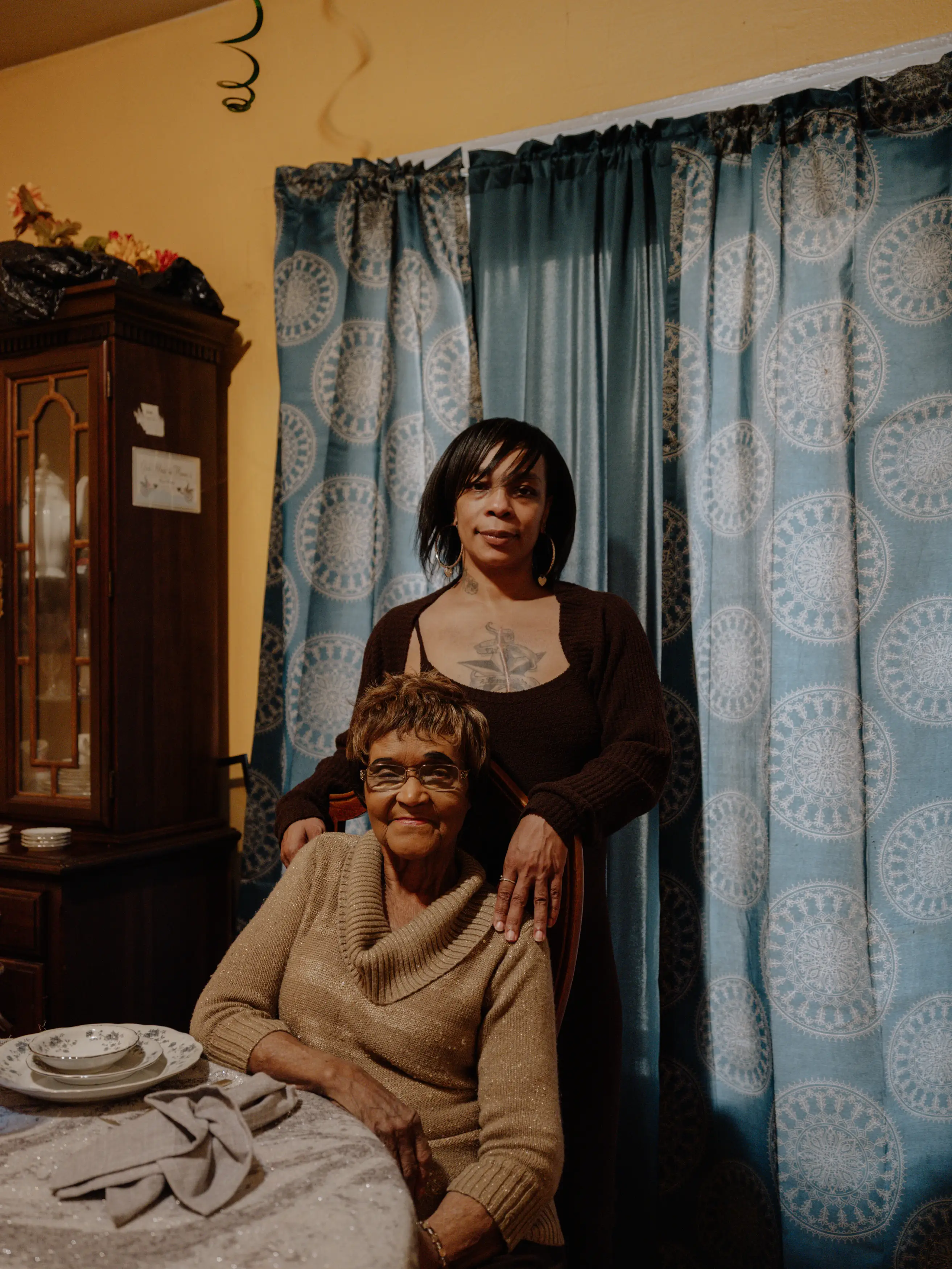 June Boyd and her daughter sitting at a table