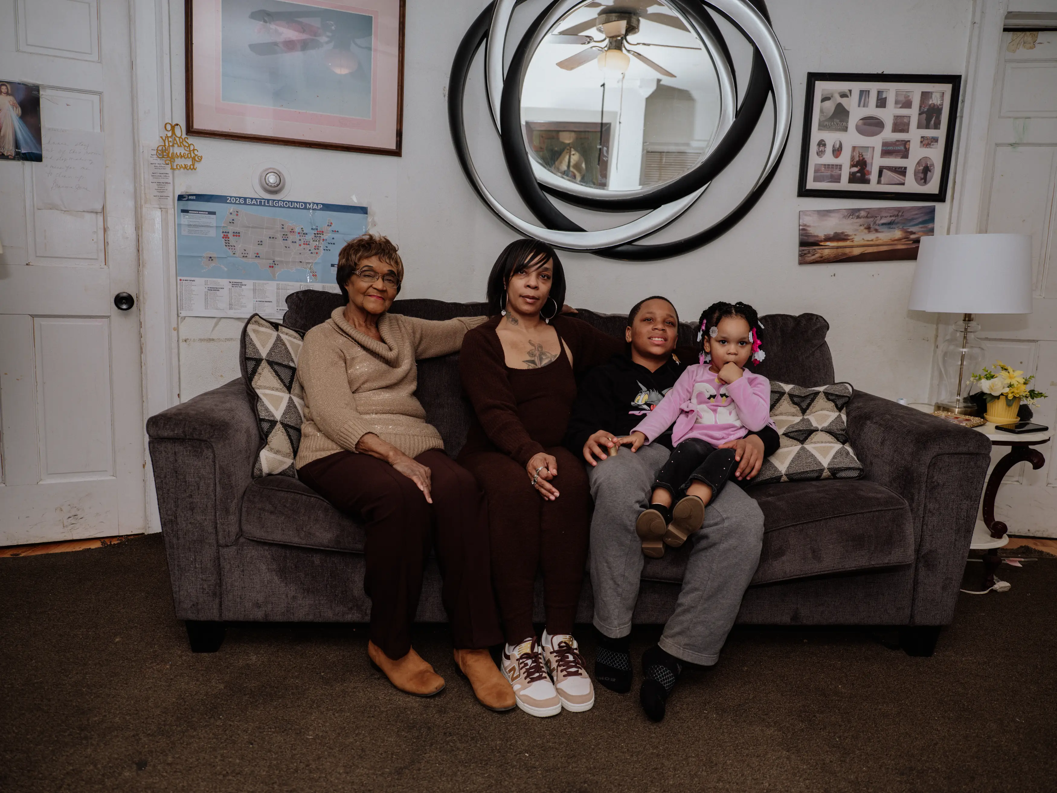 June Boyd's family sitting on the couch in their multigenerational house