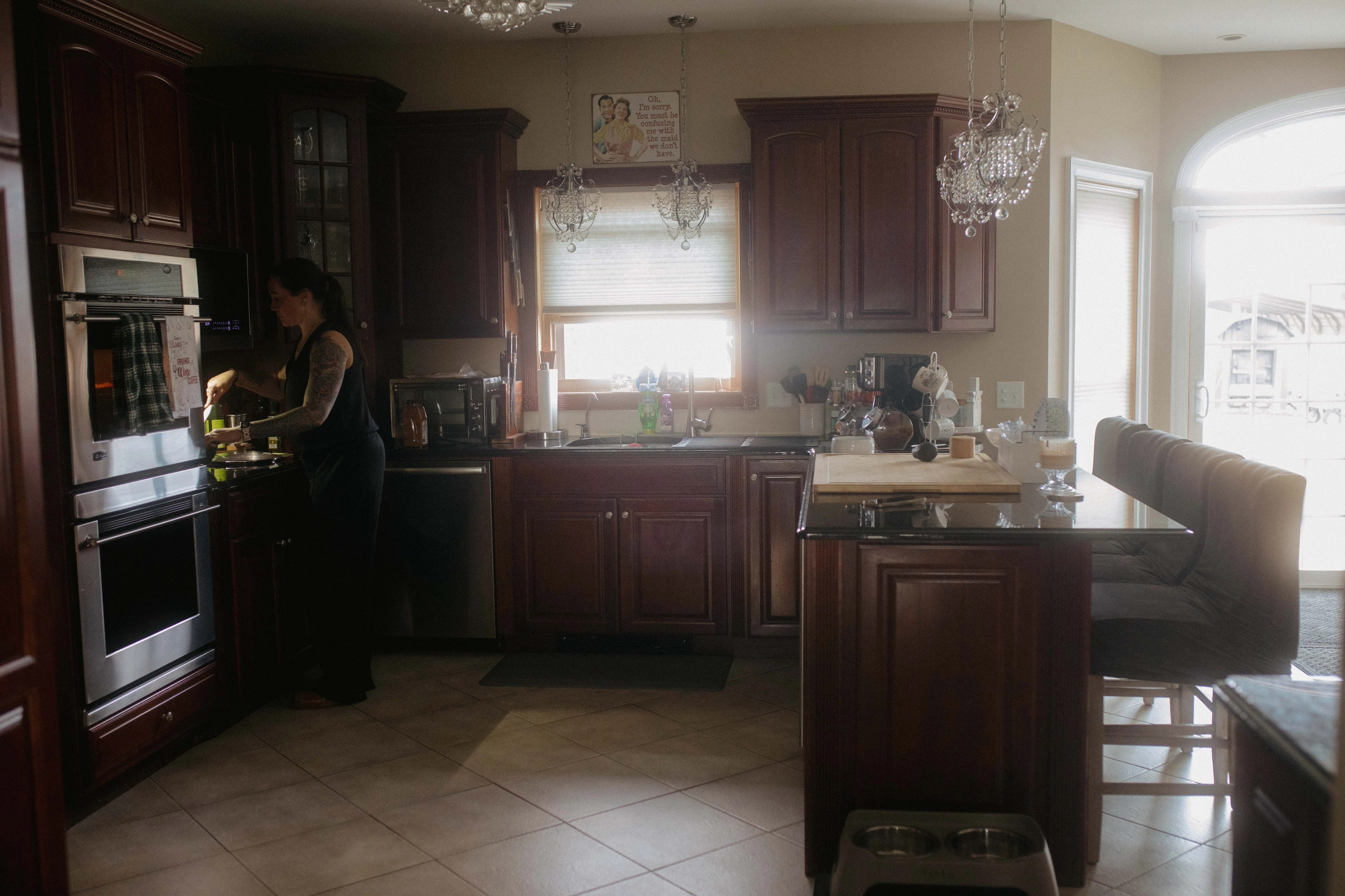 Jene Sena cooking in kitchen