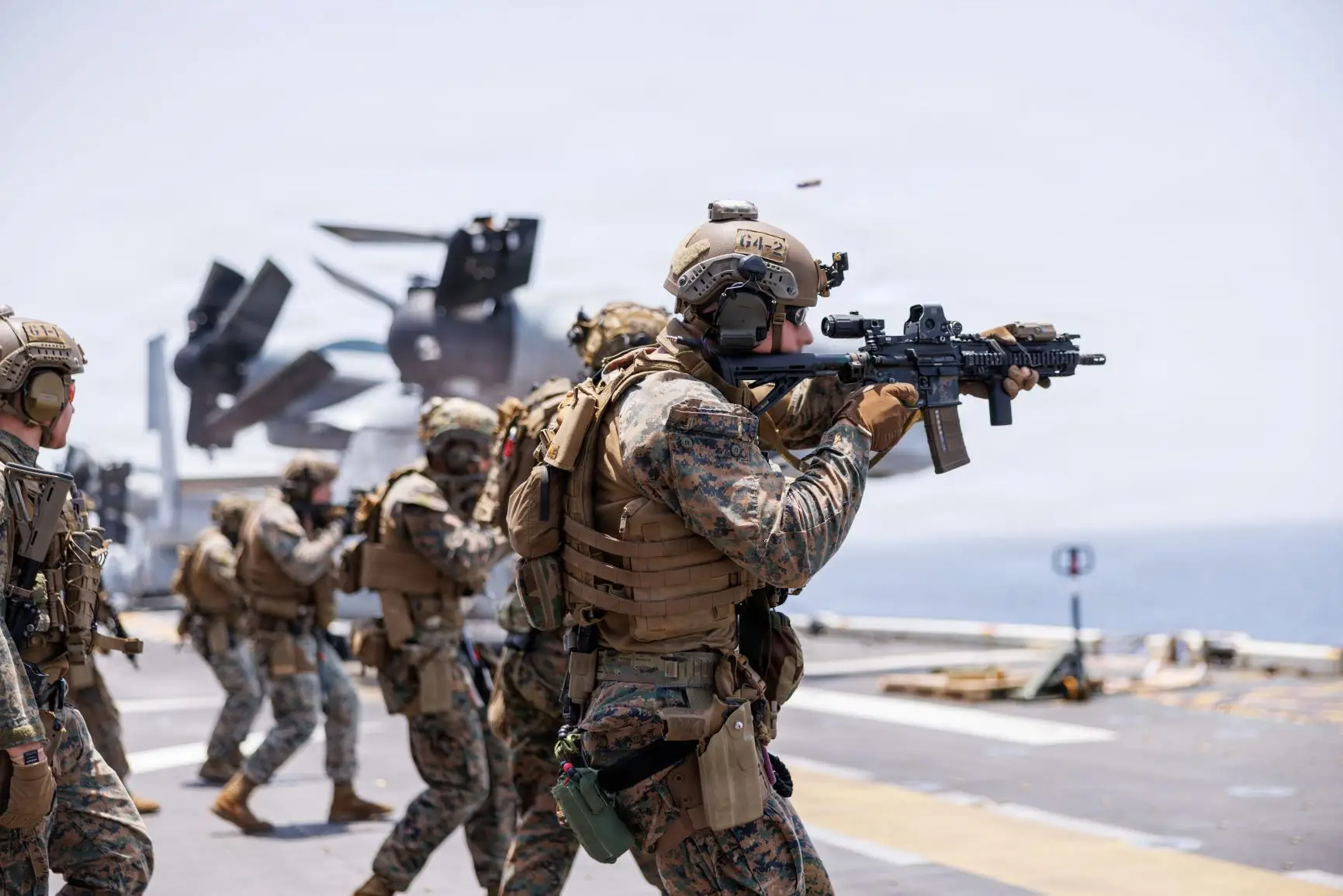 U.S. Marines fire rifles during a deck shoot aboard the forward-deployed amphibious assault ship USS Tripoli (LHA 7), in the U.S. Central Command area of responsibility during Operation Epic Fury, April 2, 2026.