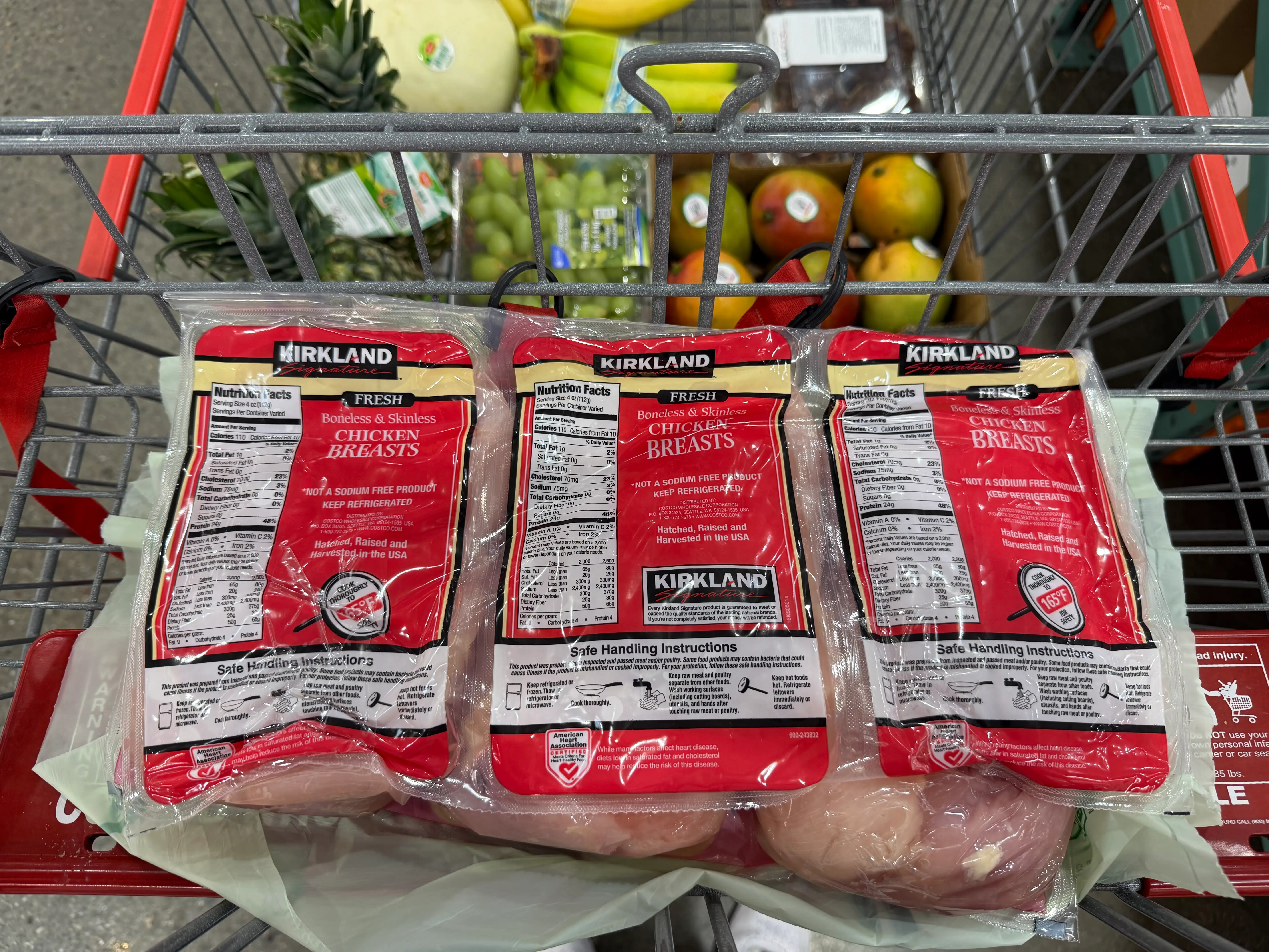 Kirkland Signature chicken breast pack in cart at Costco