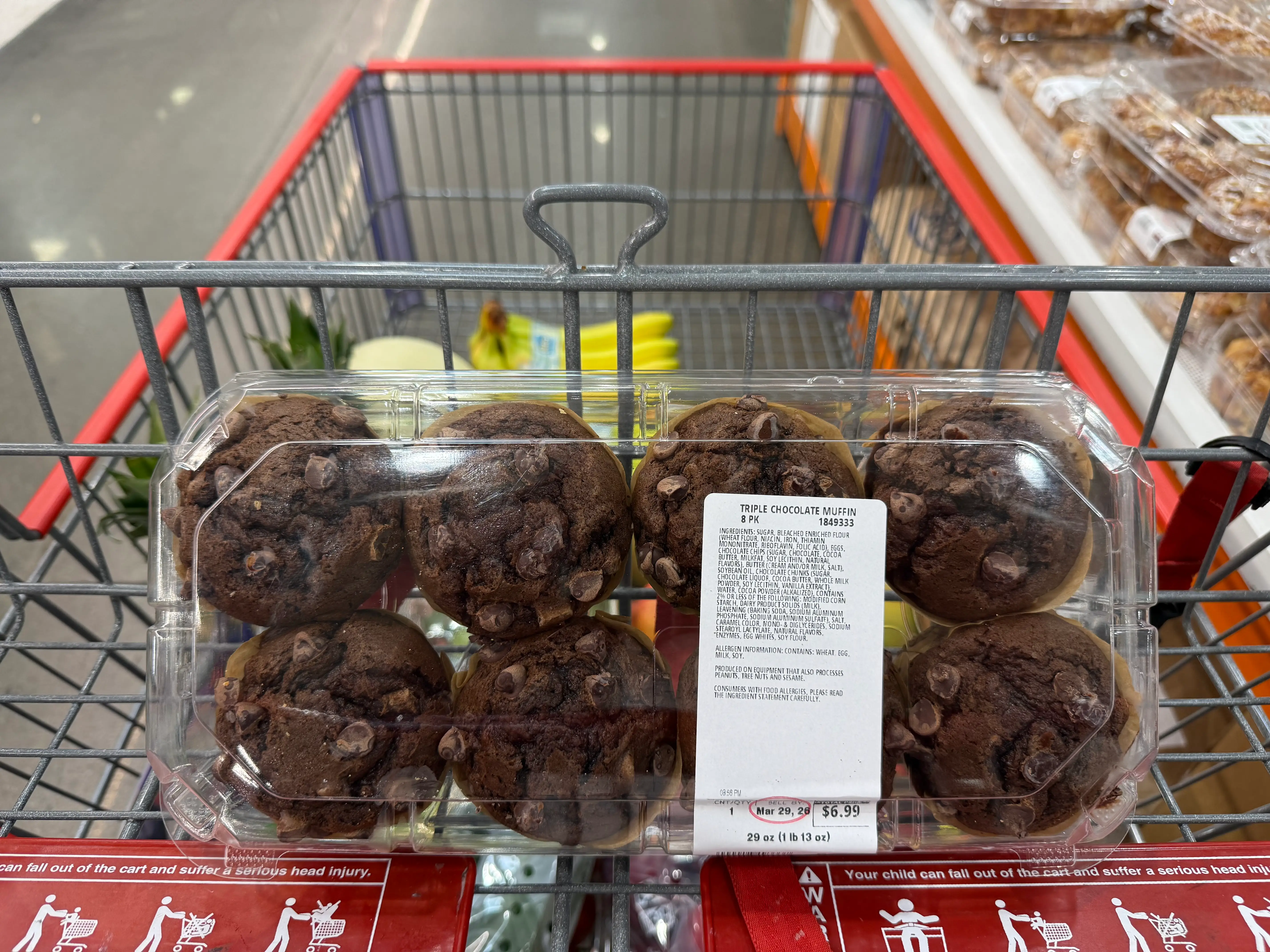 Kirkland Signature chocolate muffins in cart at Costco