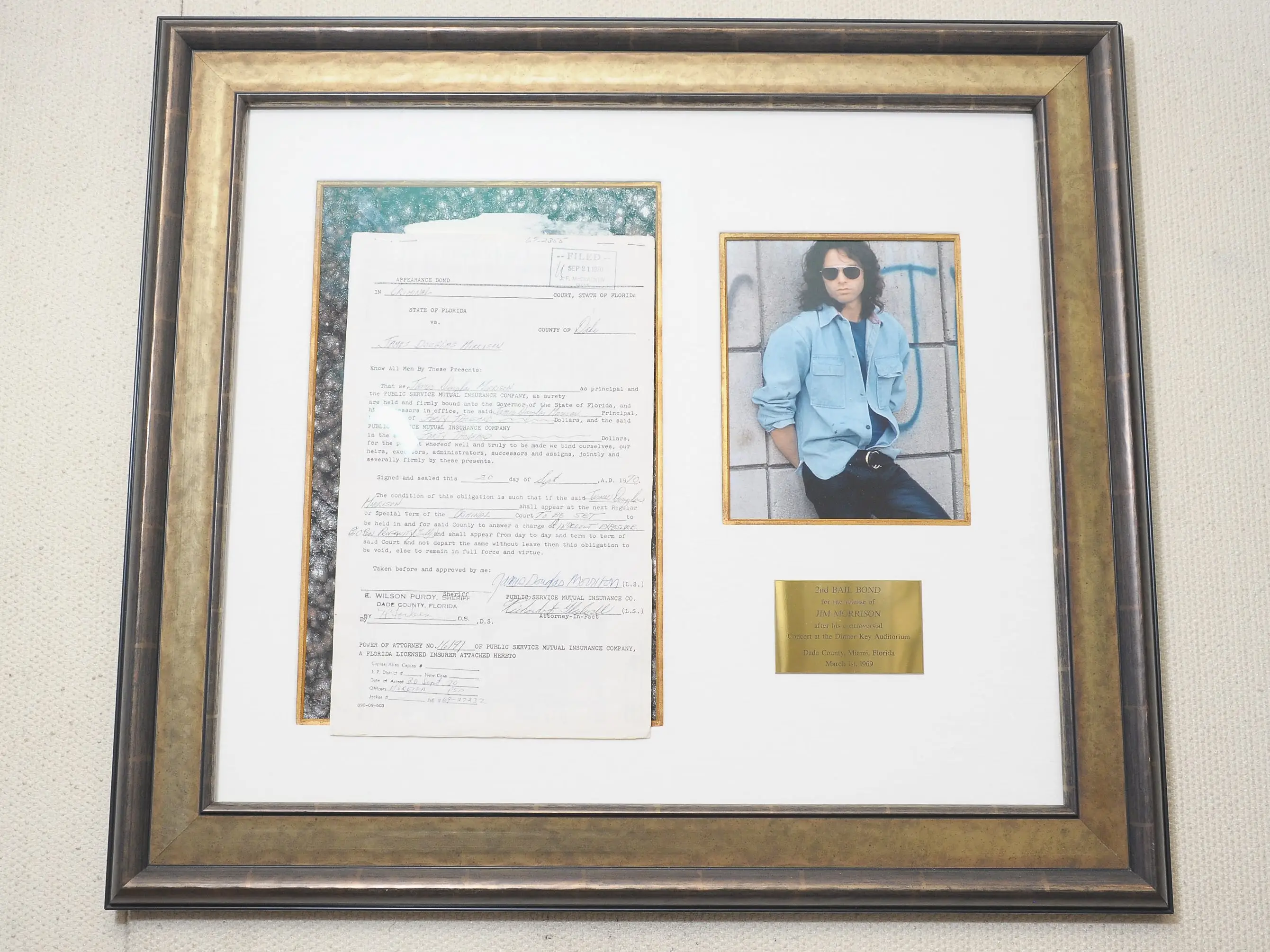Singer Jim Morrison's signed 2nd bail bond for his release from jail after his controversial concert at the Dinner Key Auditorium in Miami Florida on March 1st, 1969 on auction at Gotta Have It! store on March 21, 2012 in New York City.