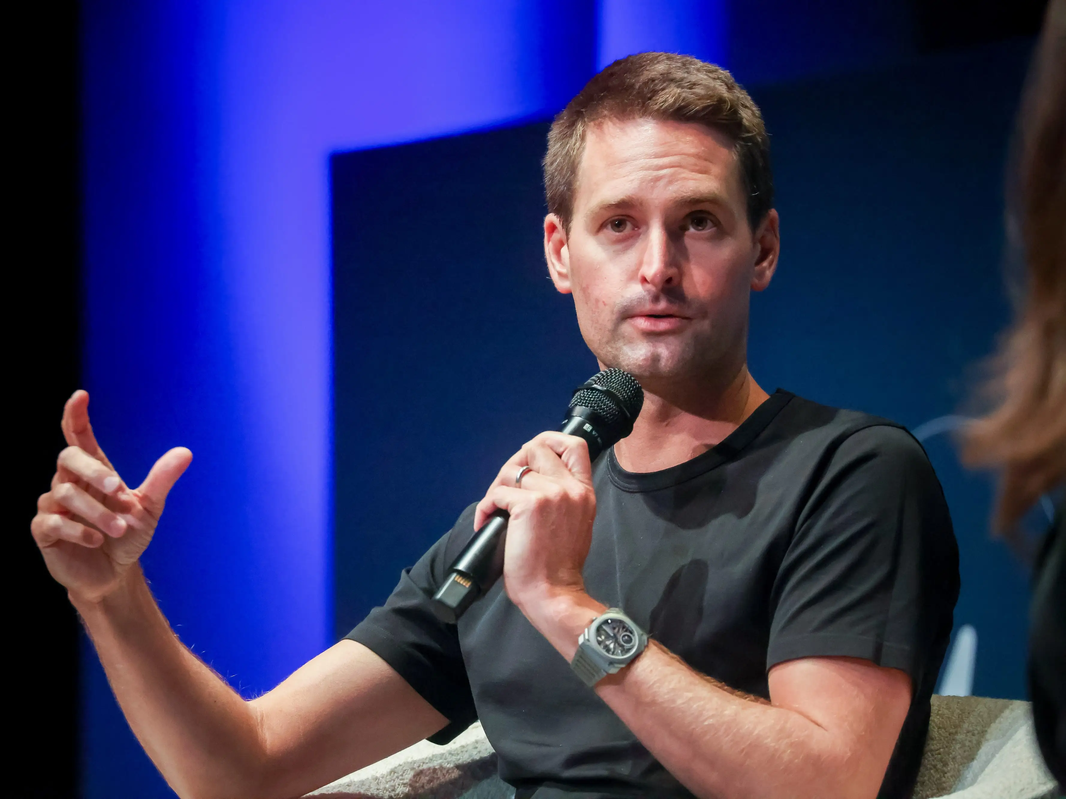 Evan Spiegel holding mic