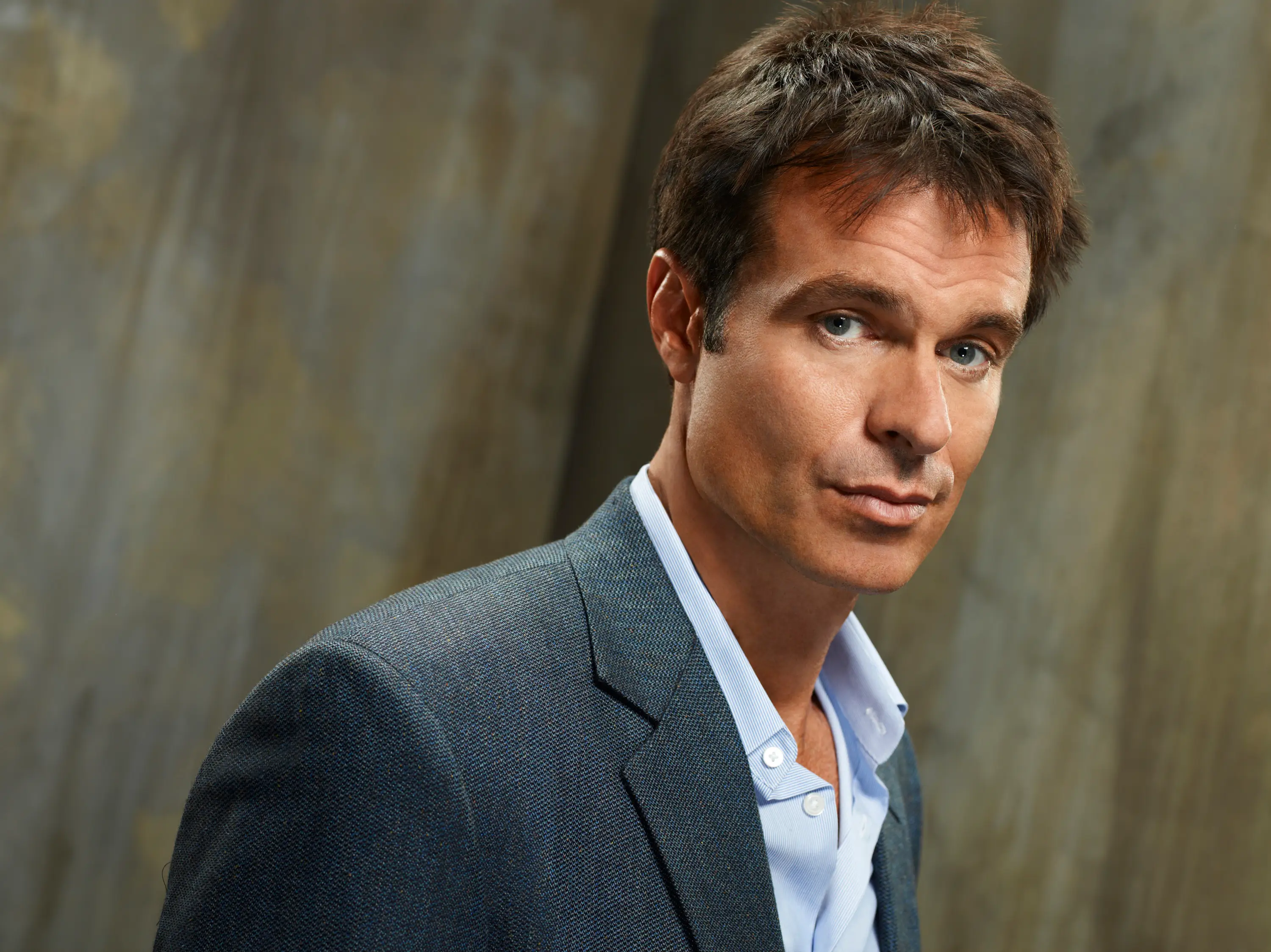 Patrick Muldoon in a grey suit