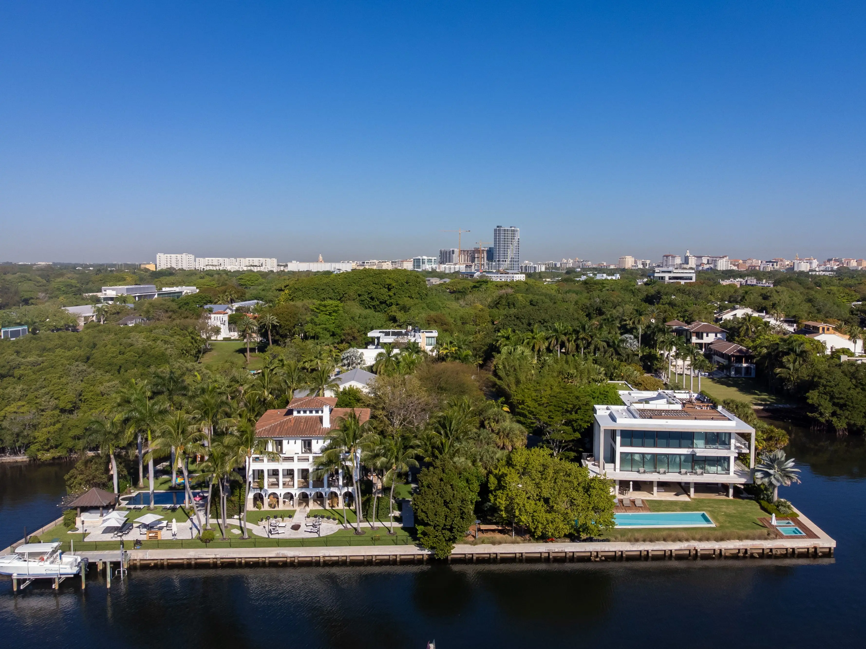 Homes in the Coconut Grove neighborhood of Miami, Florida, US, on Monday, March 23, 2026. Miami real estate brokers are seeing an influx of wealthy Californians looking for high-end homes due to the proposed 