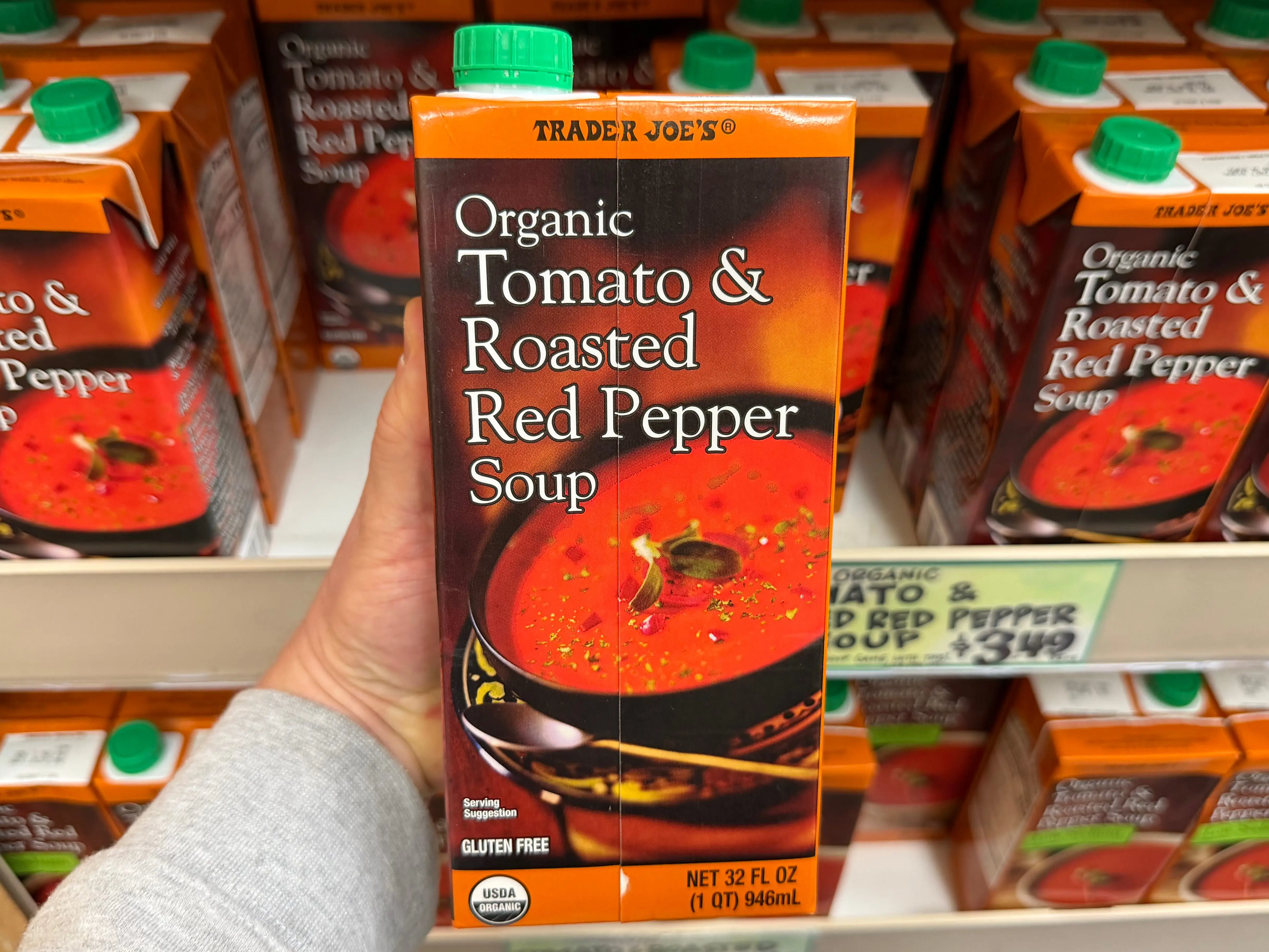 A container of the Trader Joe's organic tomato and roasted red pepper soup.