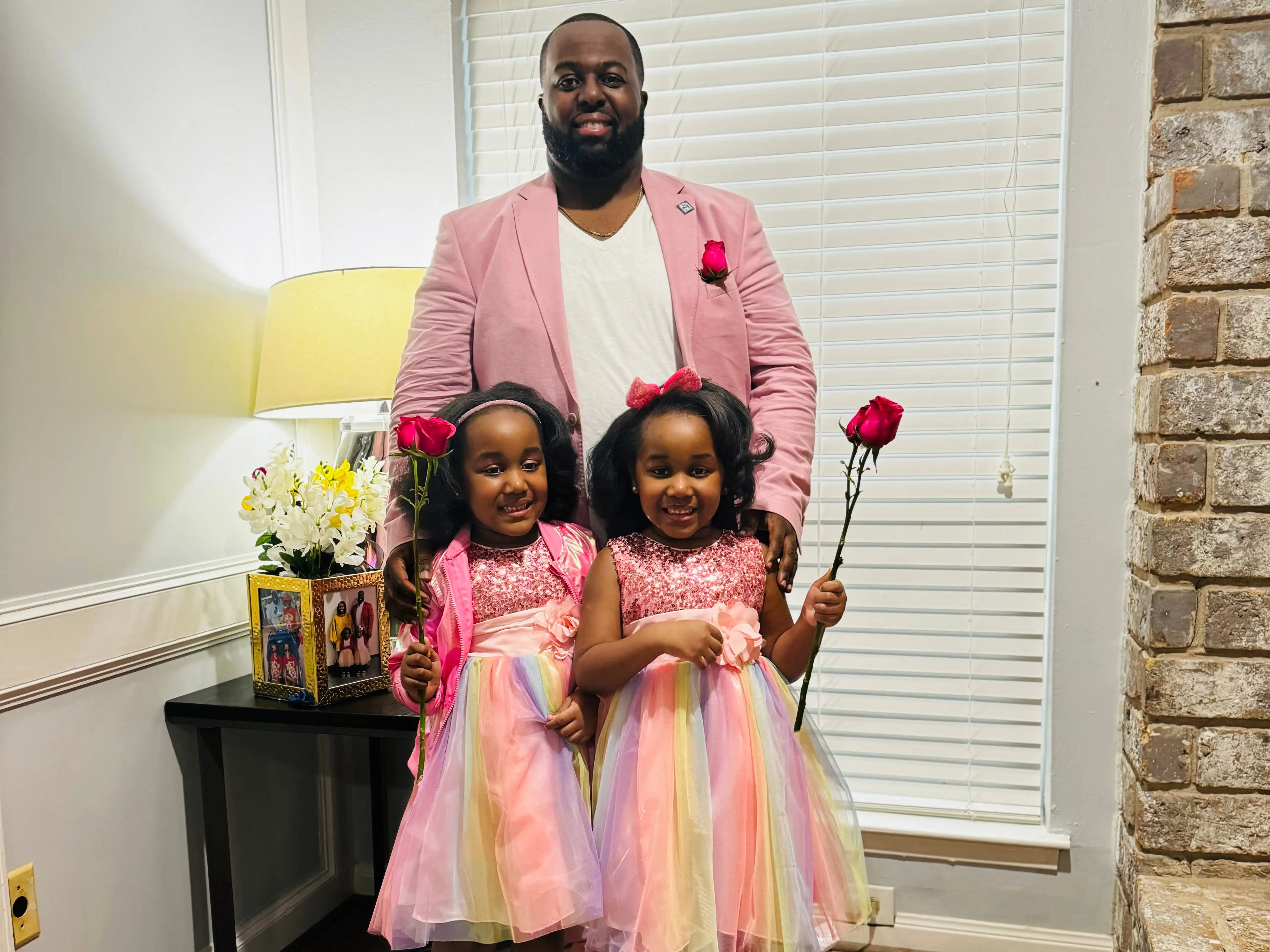 Dad with twin daughters
