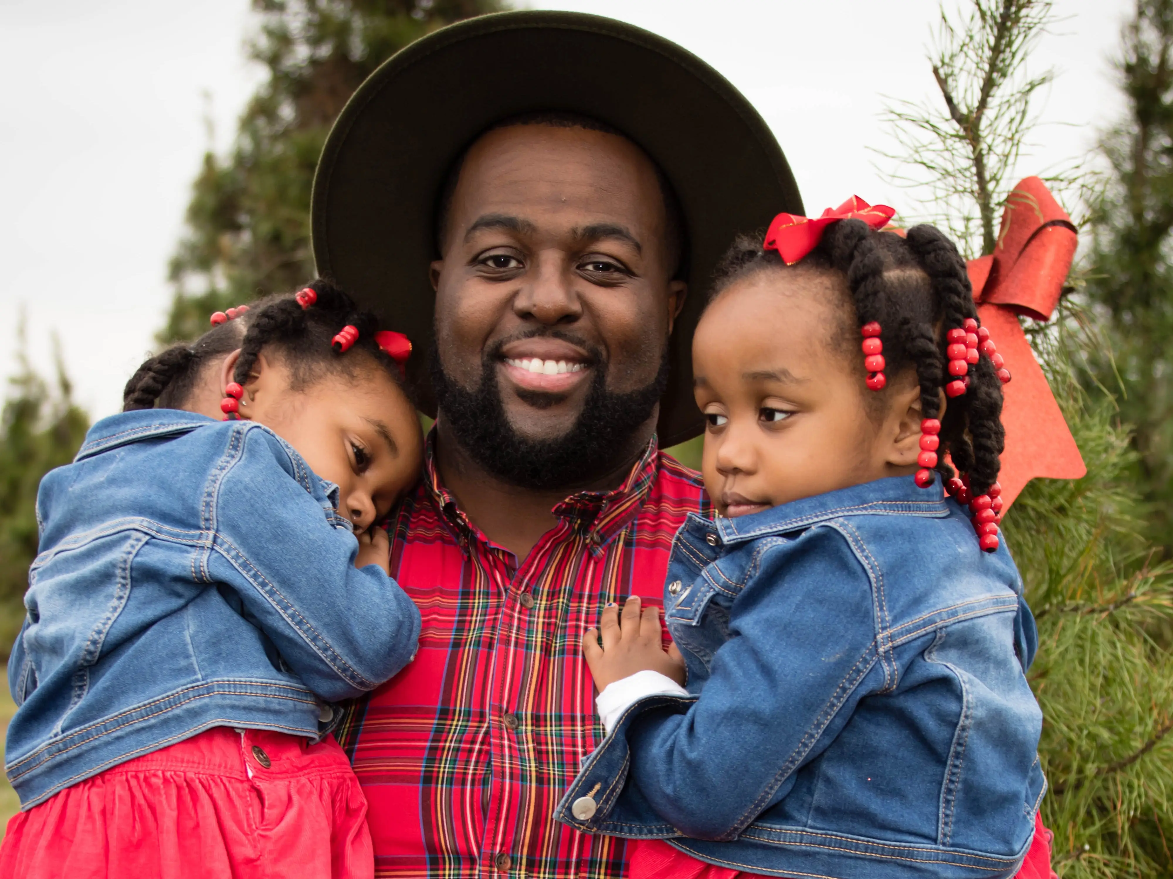 Dad holding twins