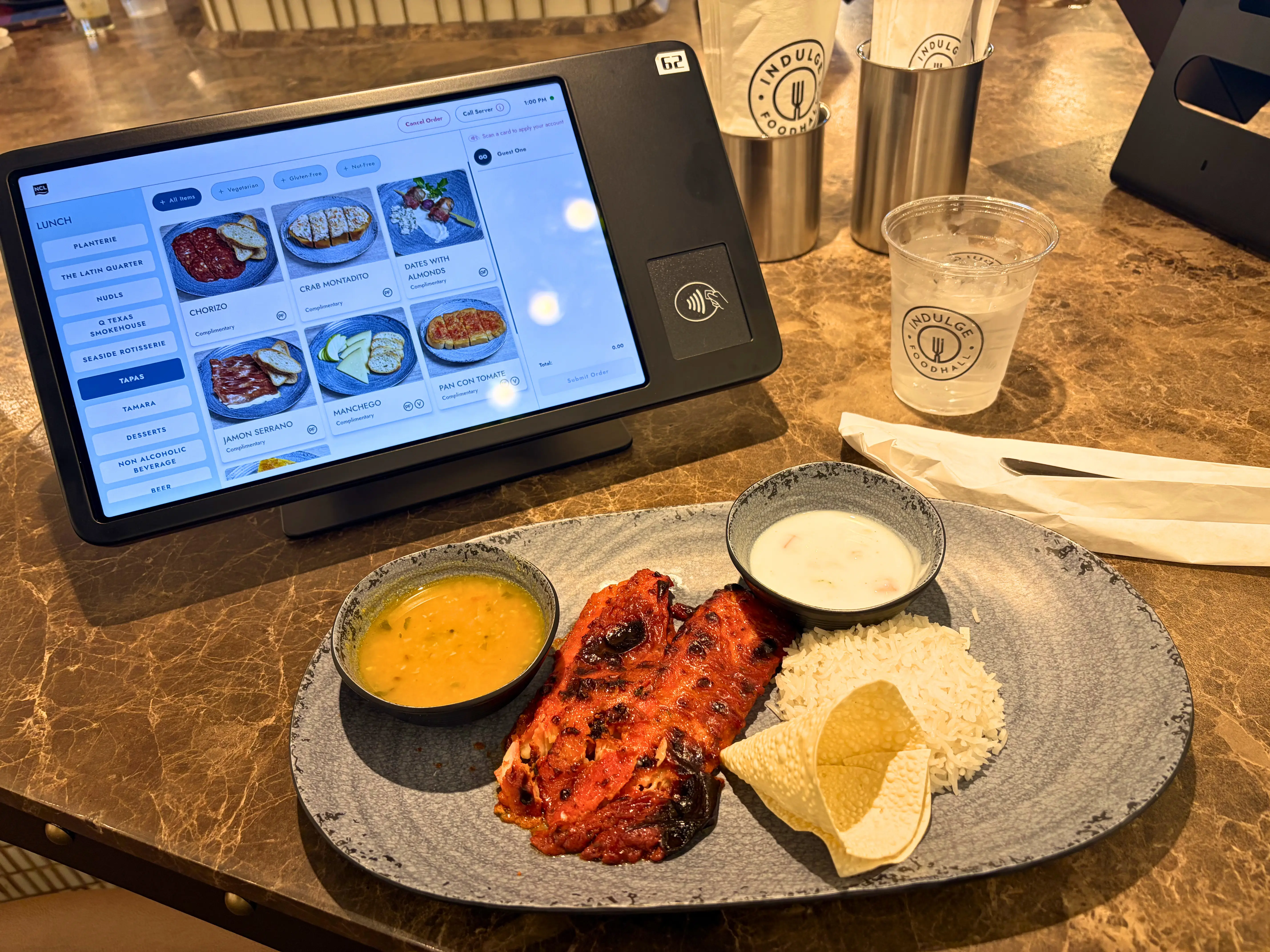 plate of food next to tablet