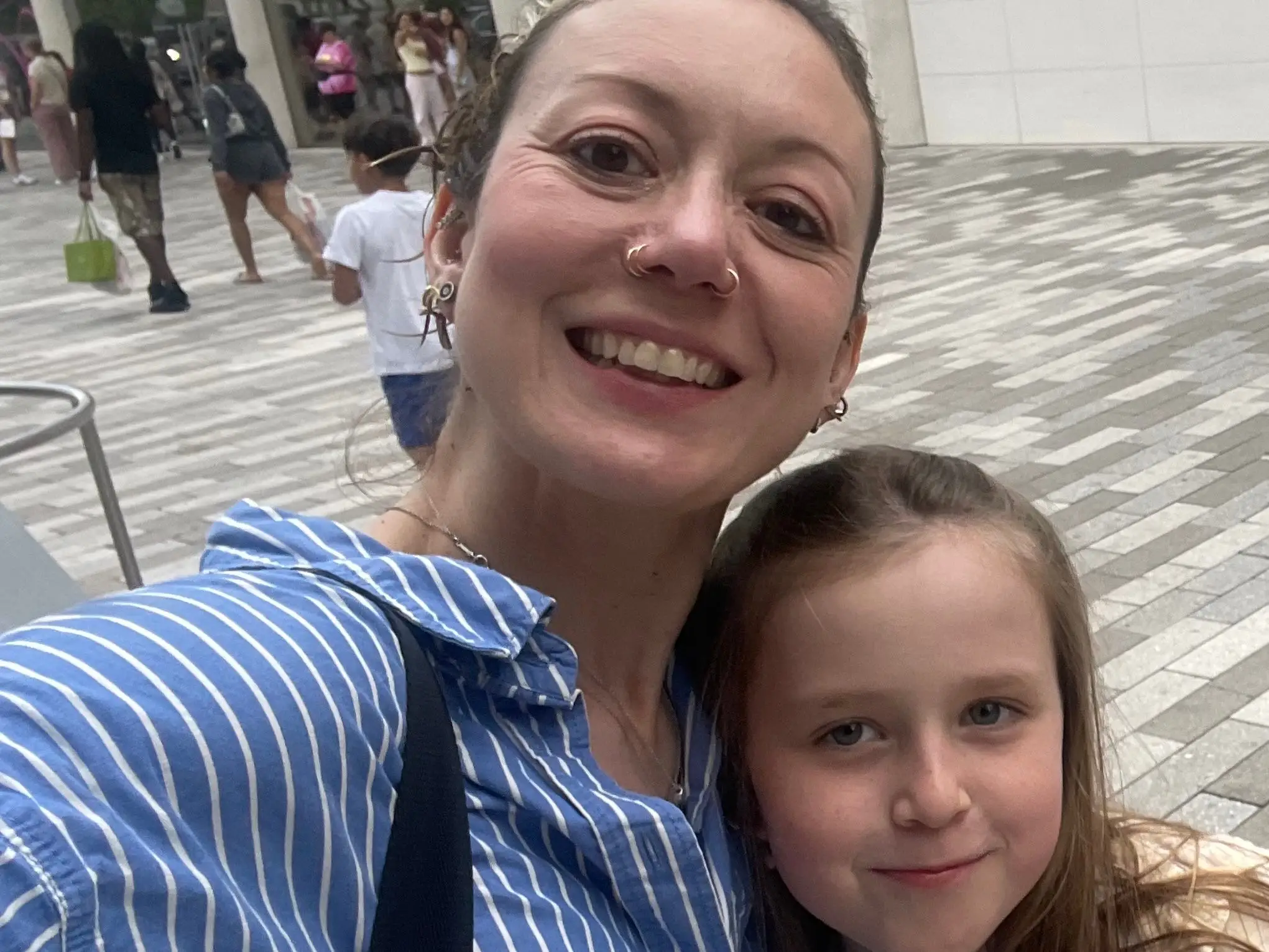 Mom and daughter posing for photo