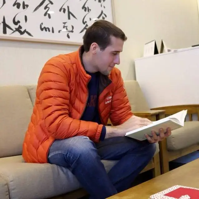 A man reading a book.