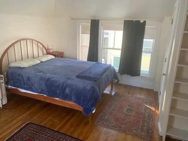 The interior of a double bedroom in a house.