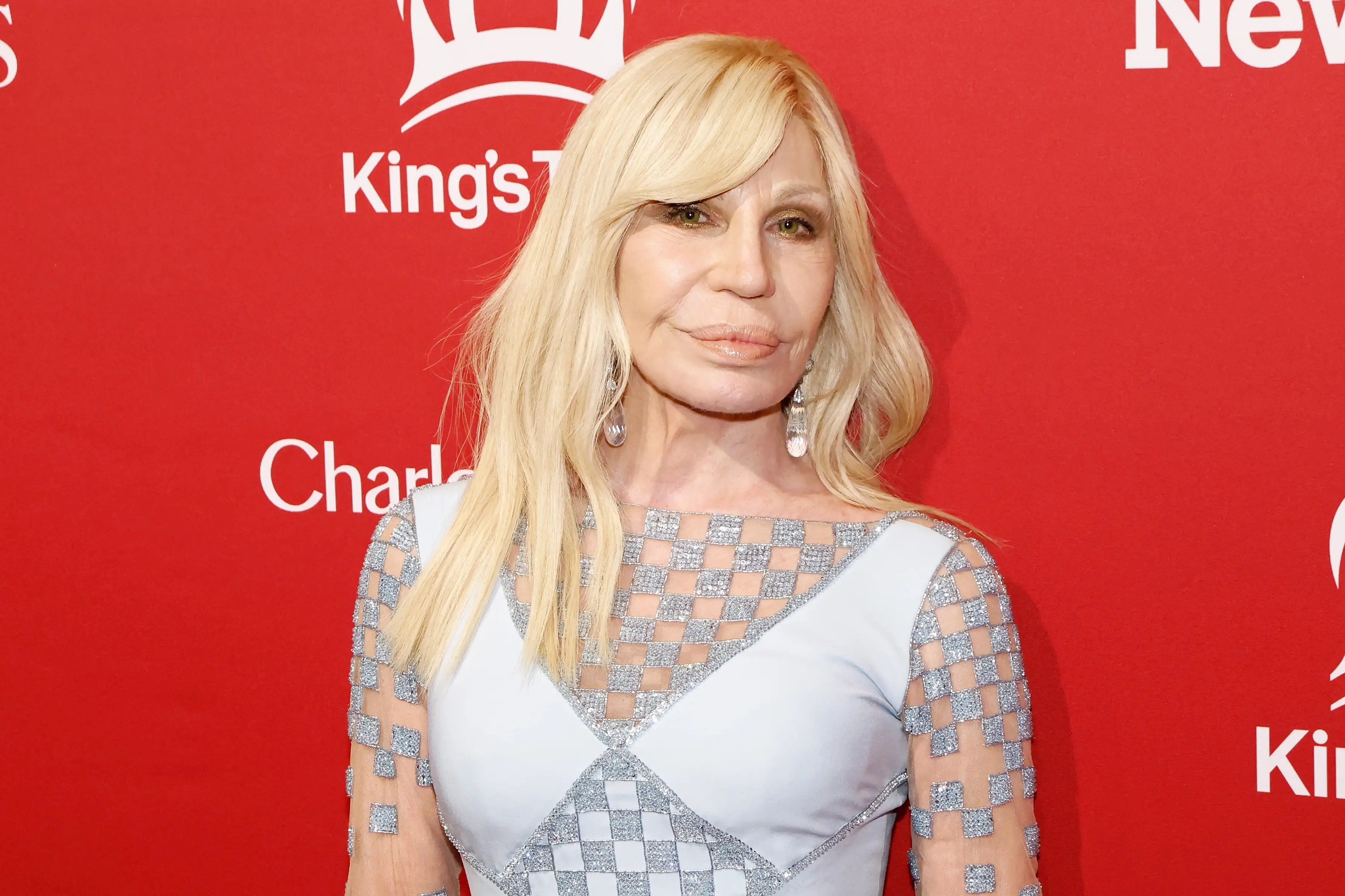 Donatella Versace in a white dress