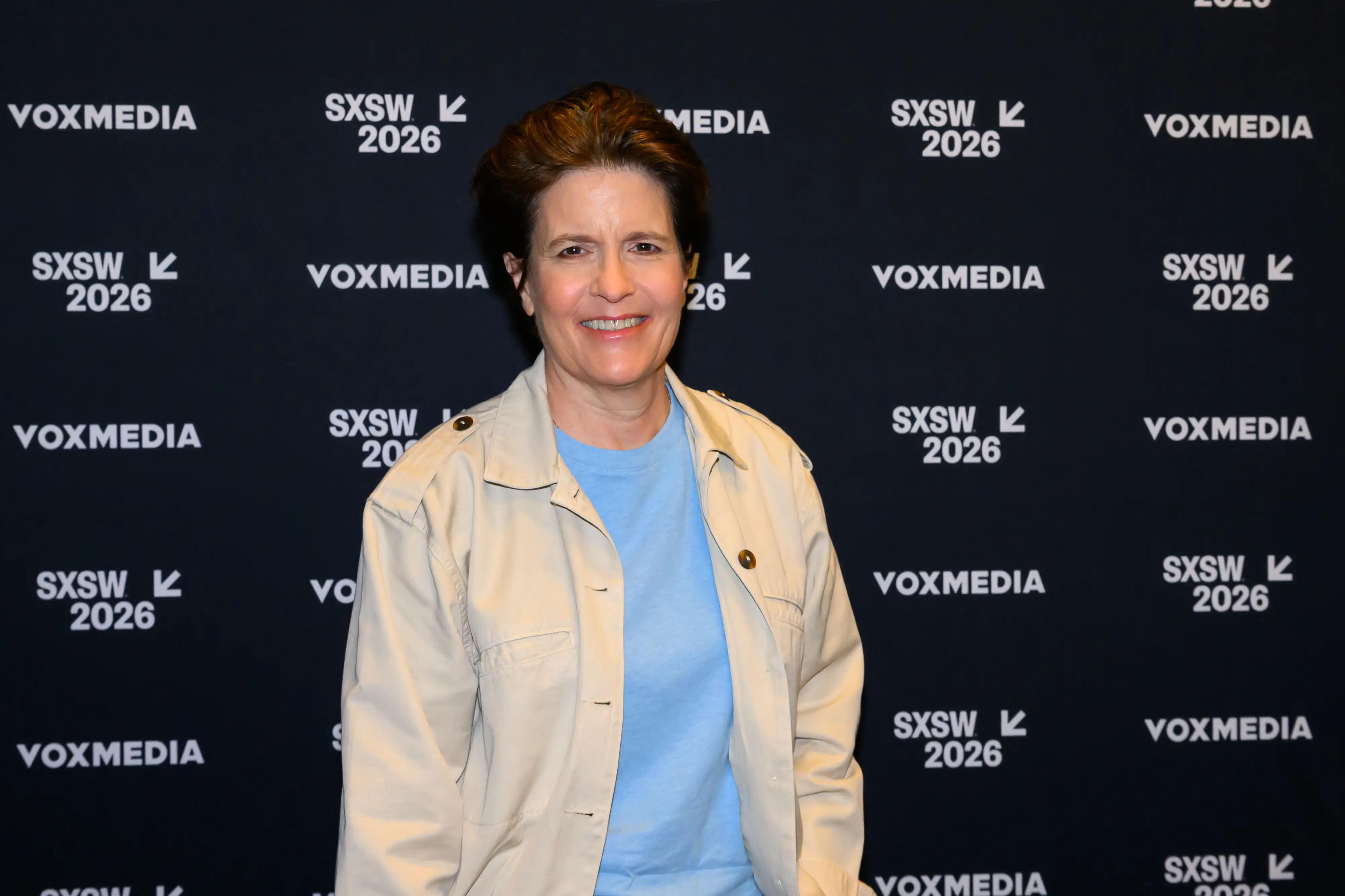 Kara Swisher in a cream jacket and blue top