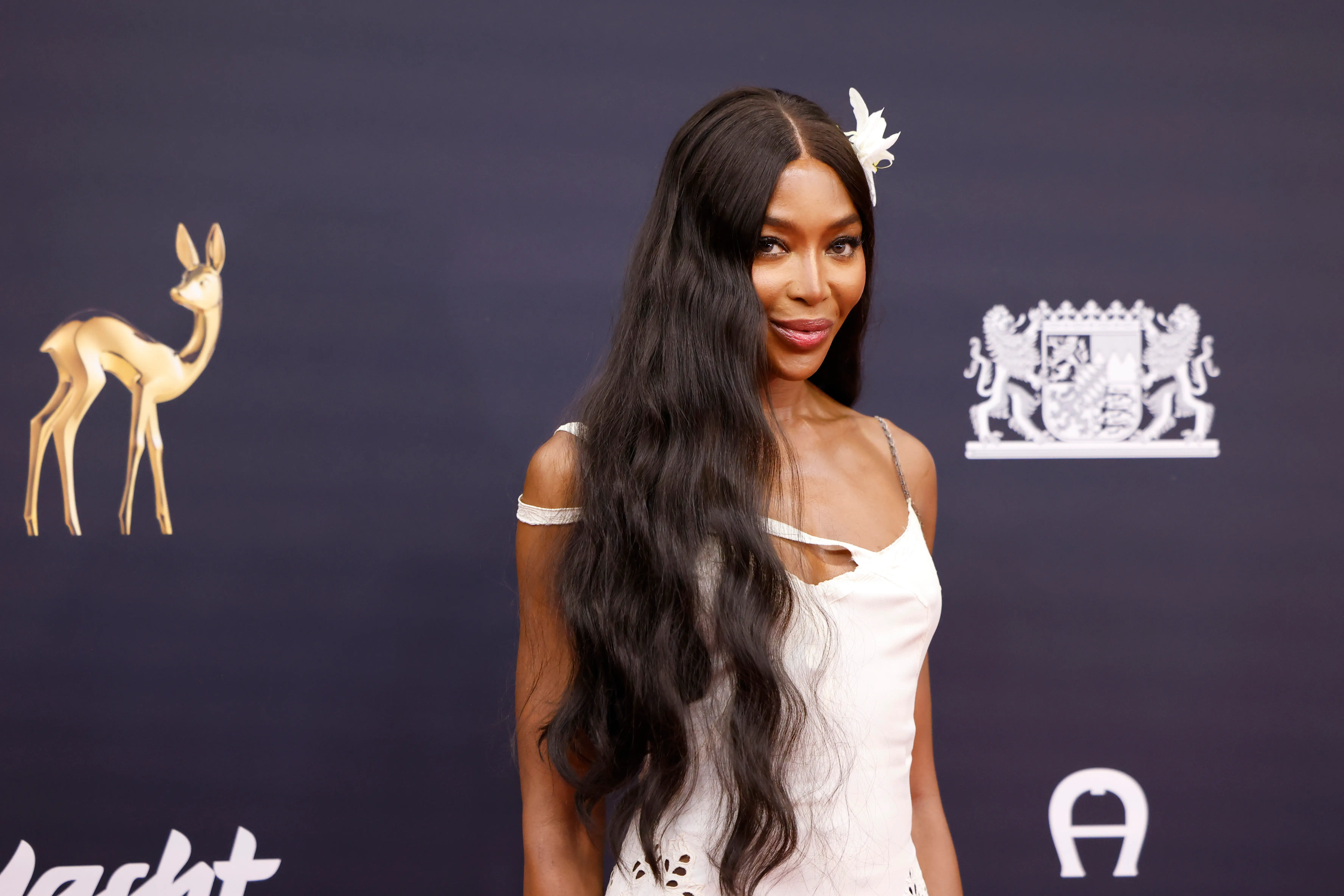 Naomi Campbell in a white dress