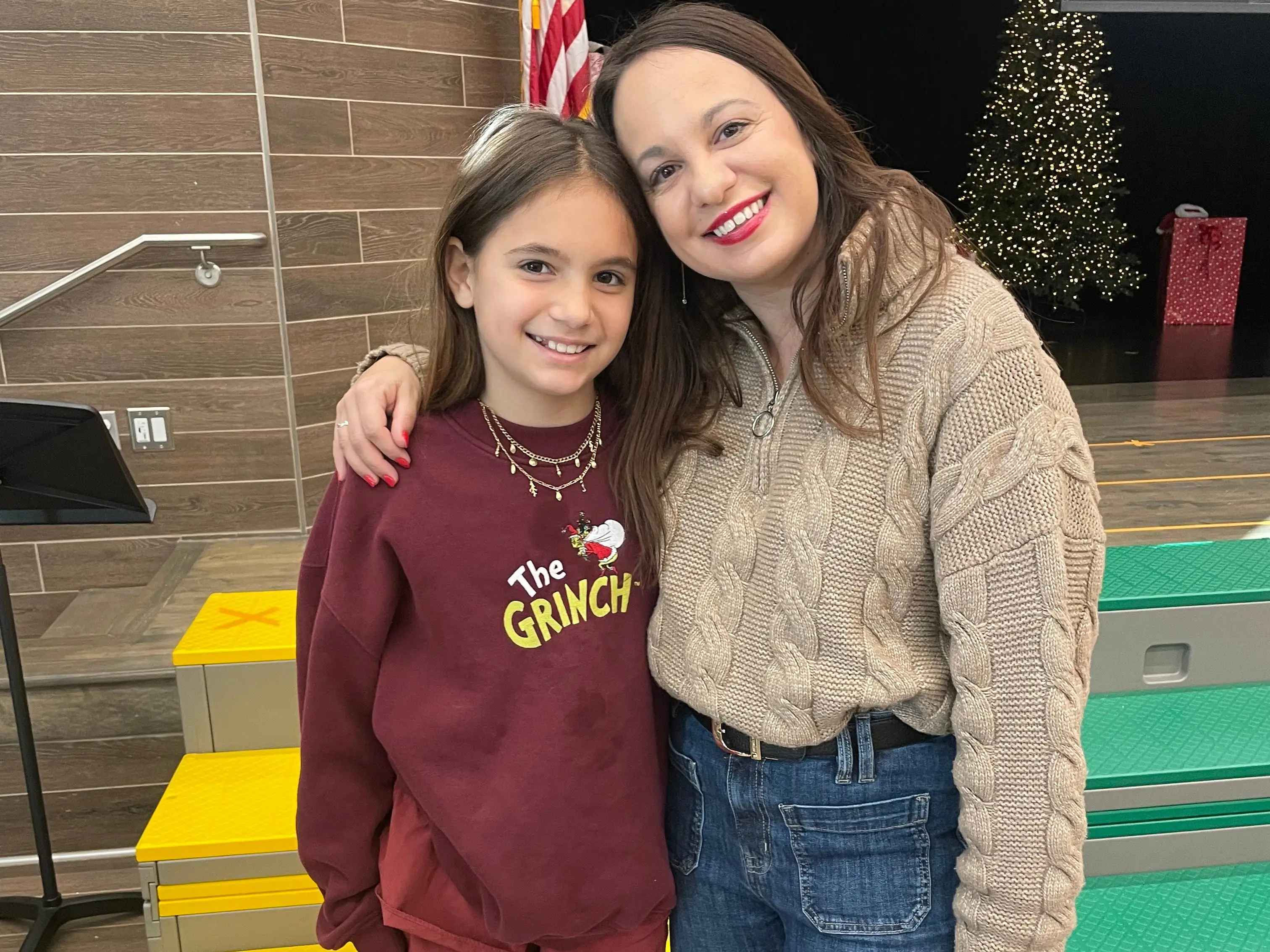 The author poses with her daughter at school.