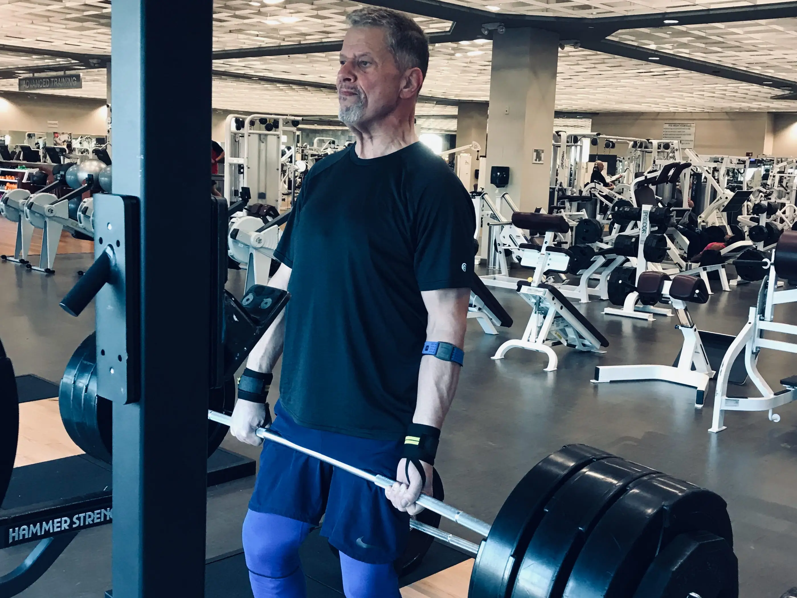 A man lifting weights at a gym