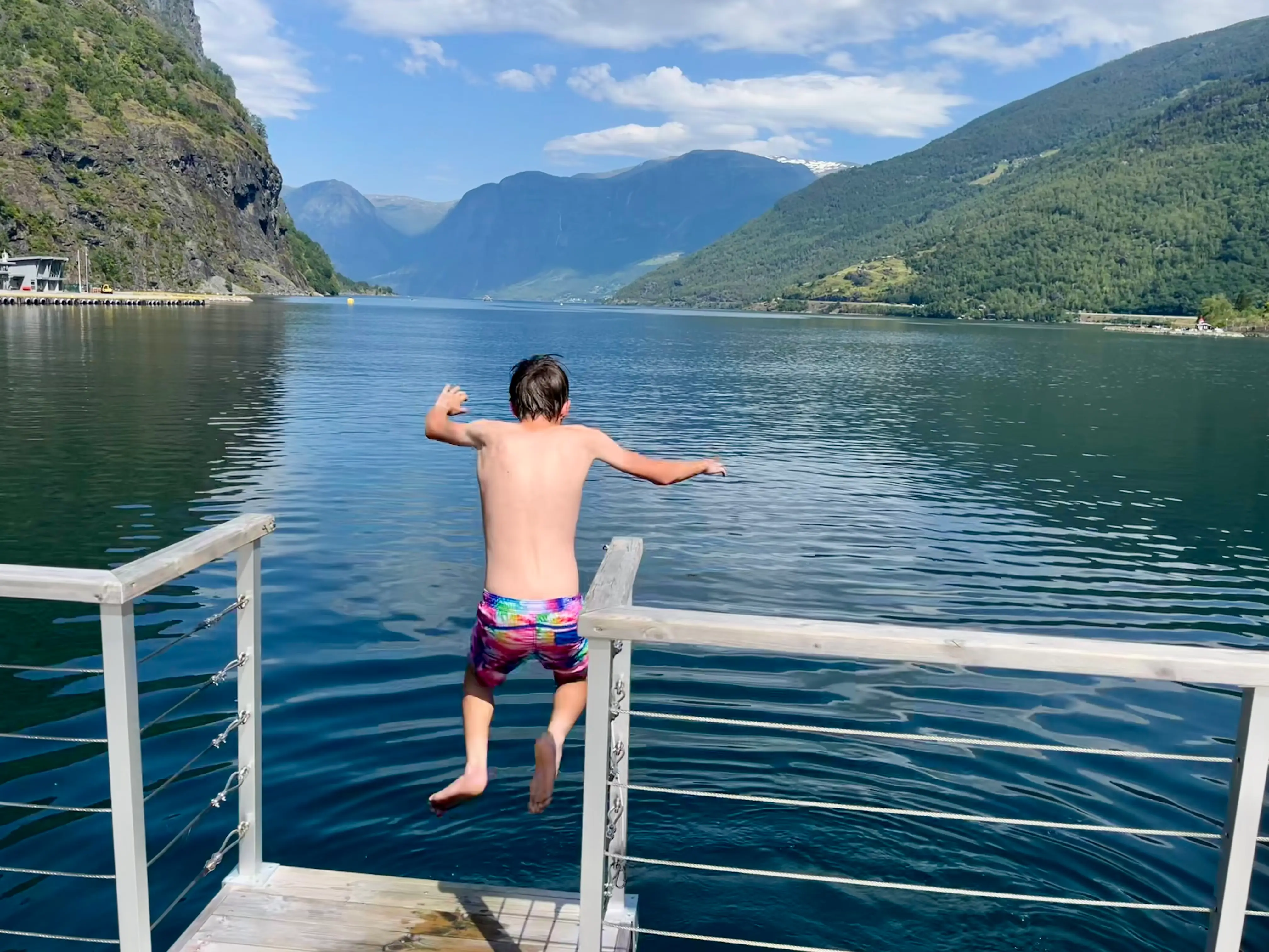 One of the author's sons jumps from the top deck of a floating sauna.