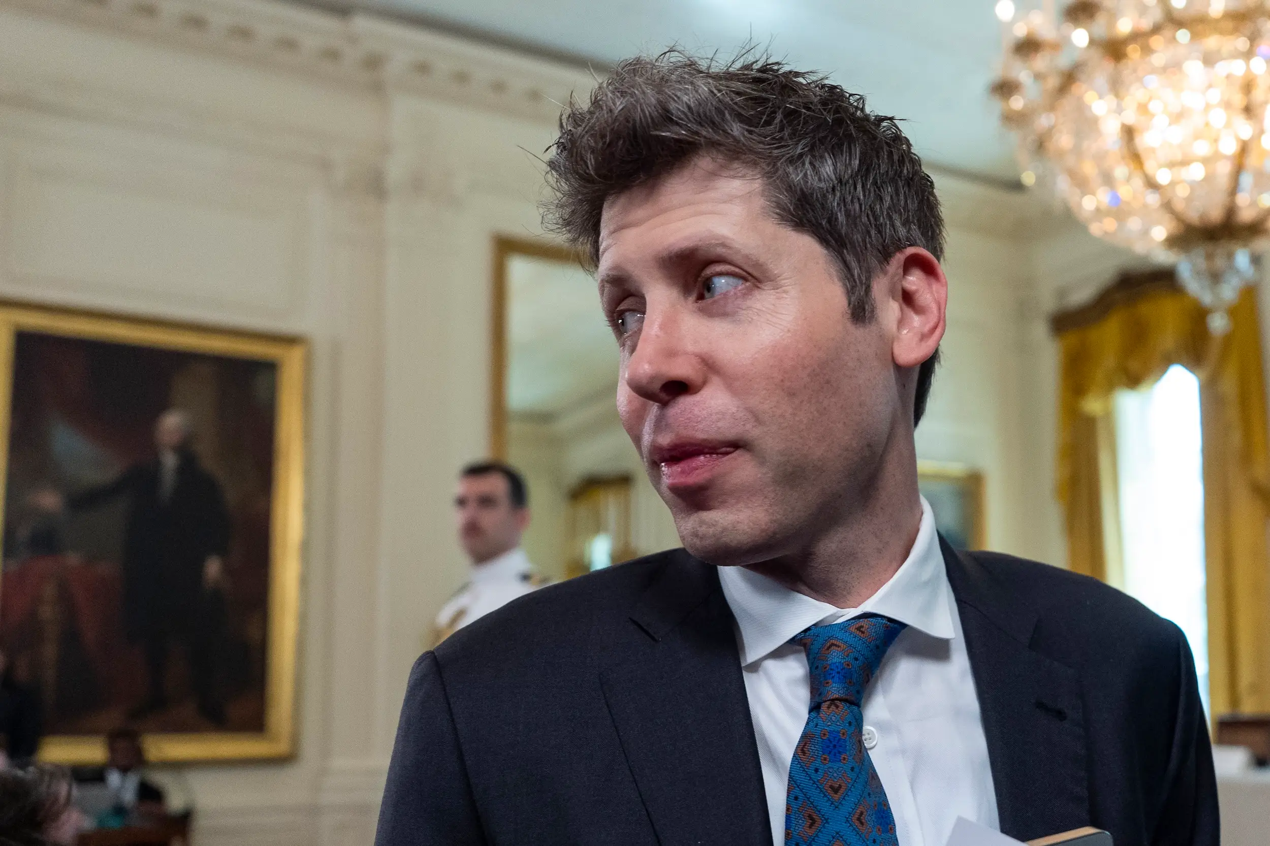 Sam Altman looks to someone while at the White House