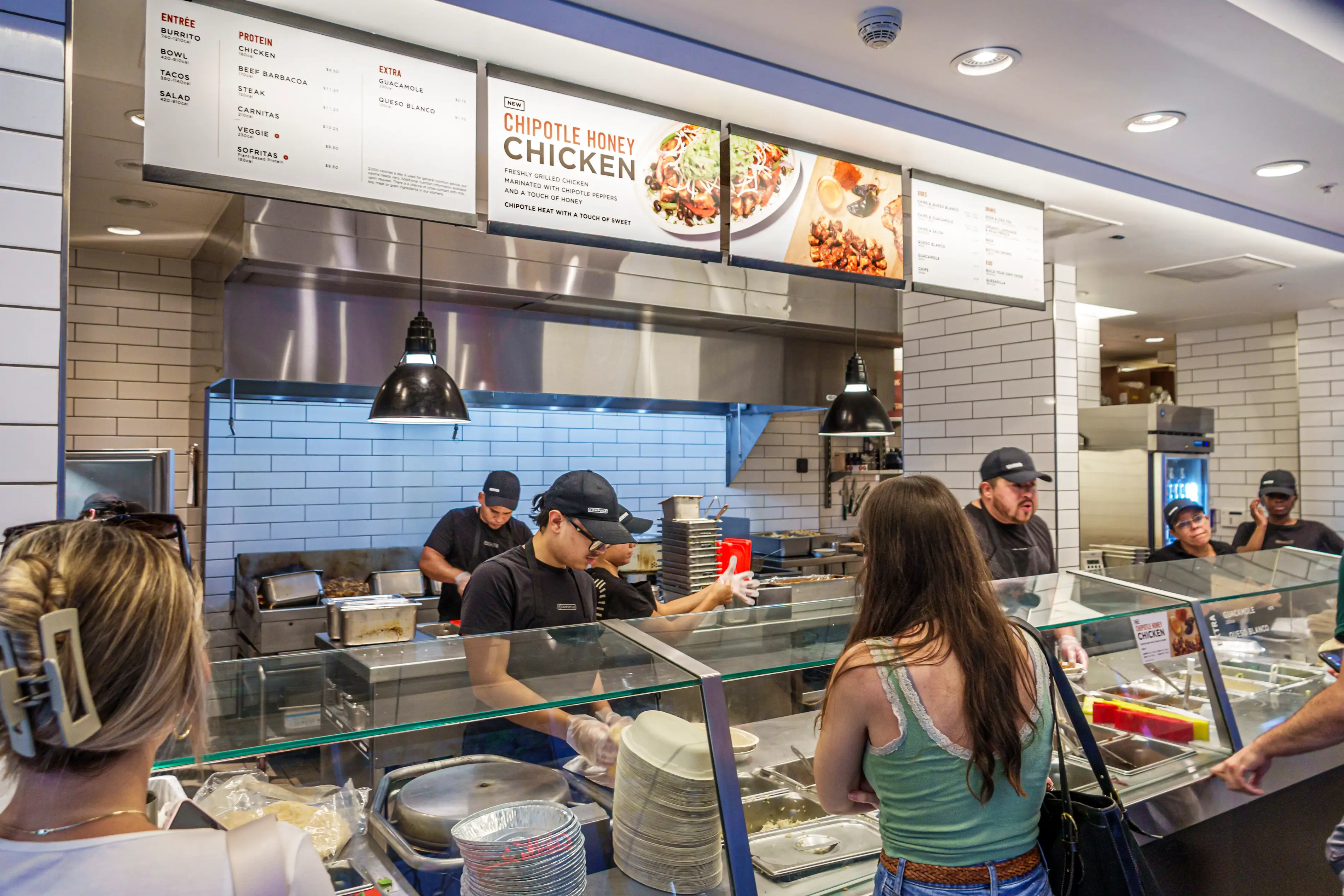 A Chipotle restaurant during a mealtime rush.