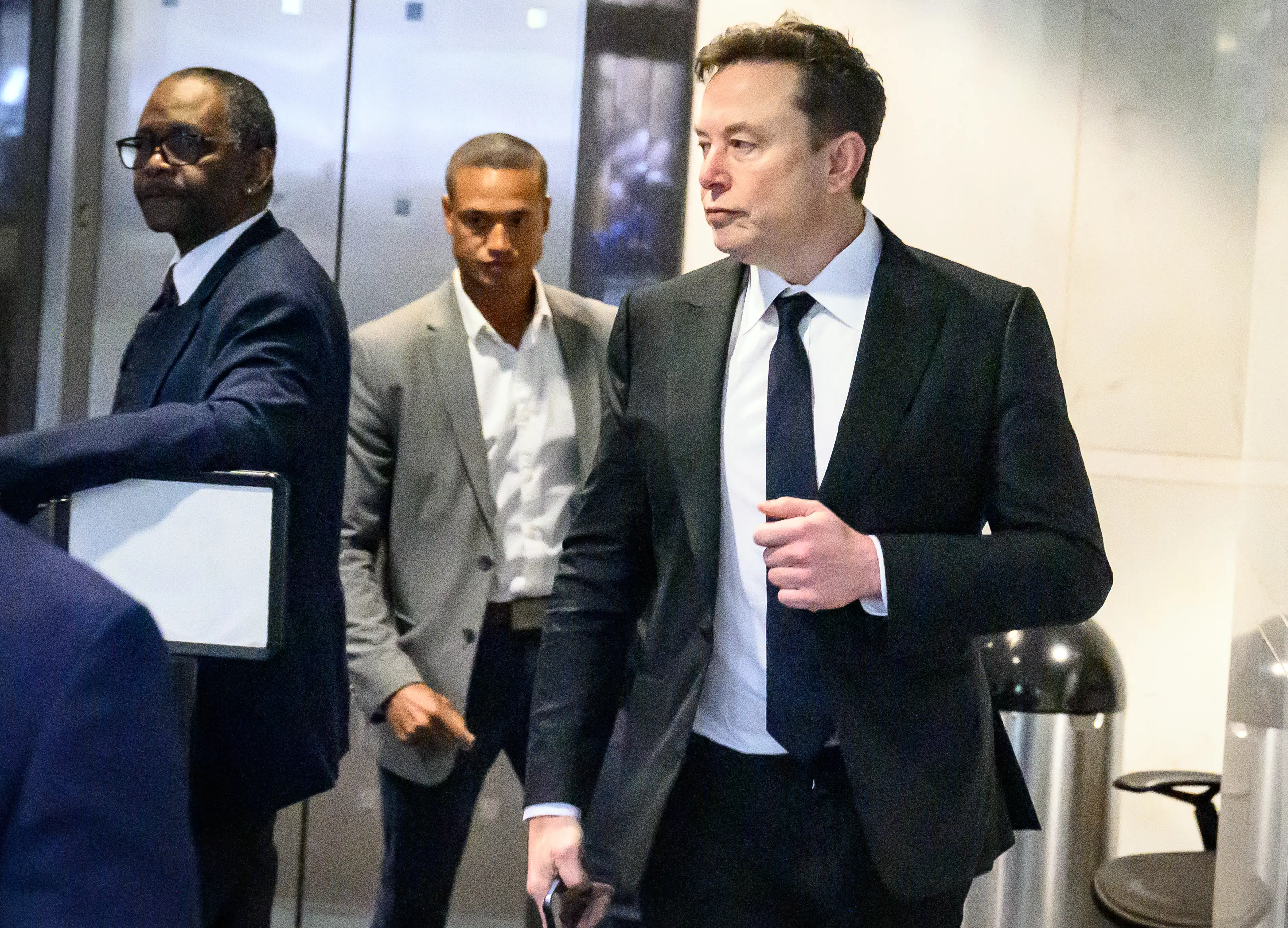 Elon Musk arrives at the federal courthouse during proceedings in the trial over his lawsuit against OpenAI in Oakland, California, on April 30, 2026. Billionaire Elon Musk took the stand April 28 to accuse OpenAI and its boss Sam Altman of betraying the AI company's altruistic origins, in a trial that could have far-reaching consequences for the industry and oblige the ChatGPT maker to profoundly revamp its business. The legal clash across the bay from San Francisco is widely seen as a battle of egos pitting the world's richest person against a startup Musk once backed and now trails in the booming AI sector. (Photo by JOSH EDELSON / AFP via Getty Images)