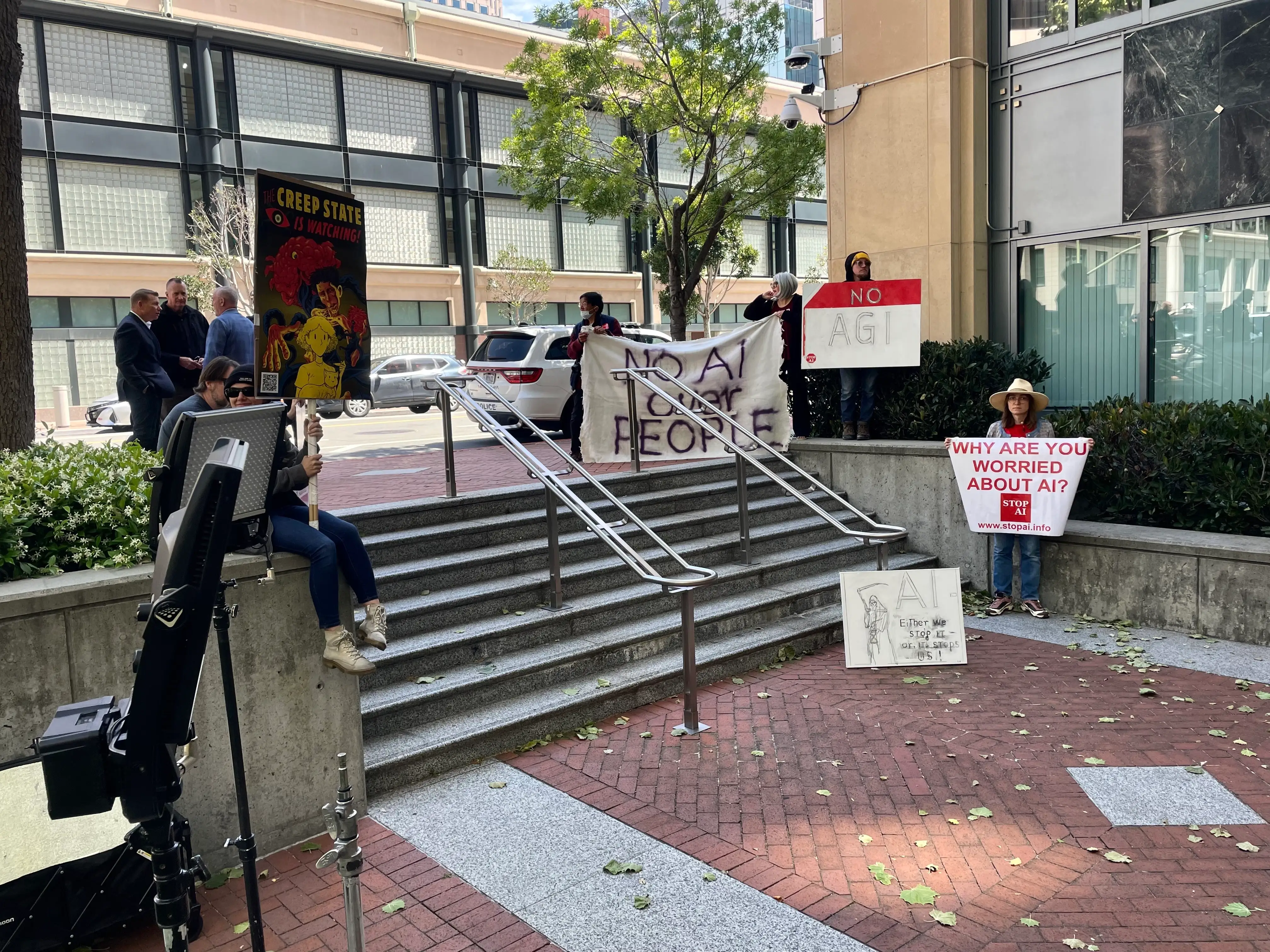 Anti-ai protestors with signs