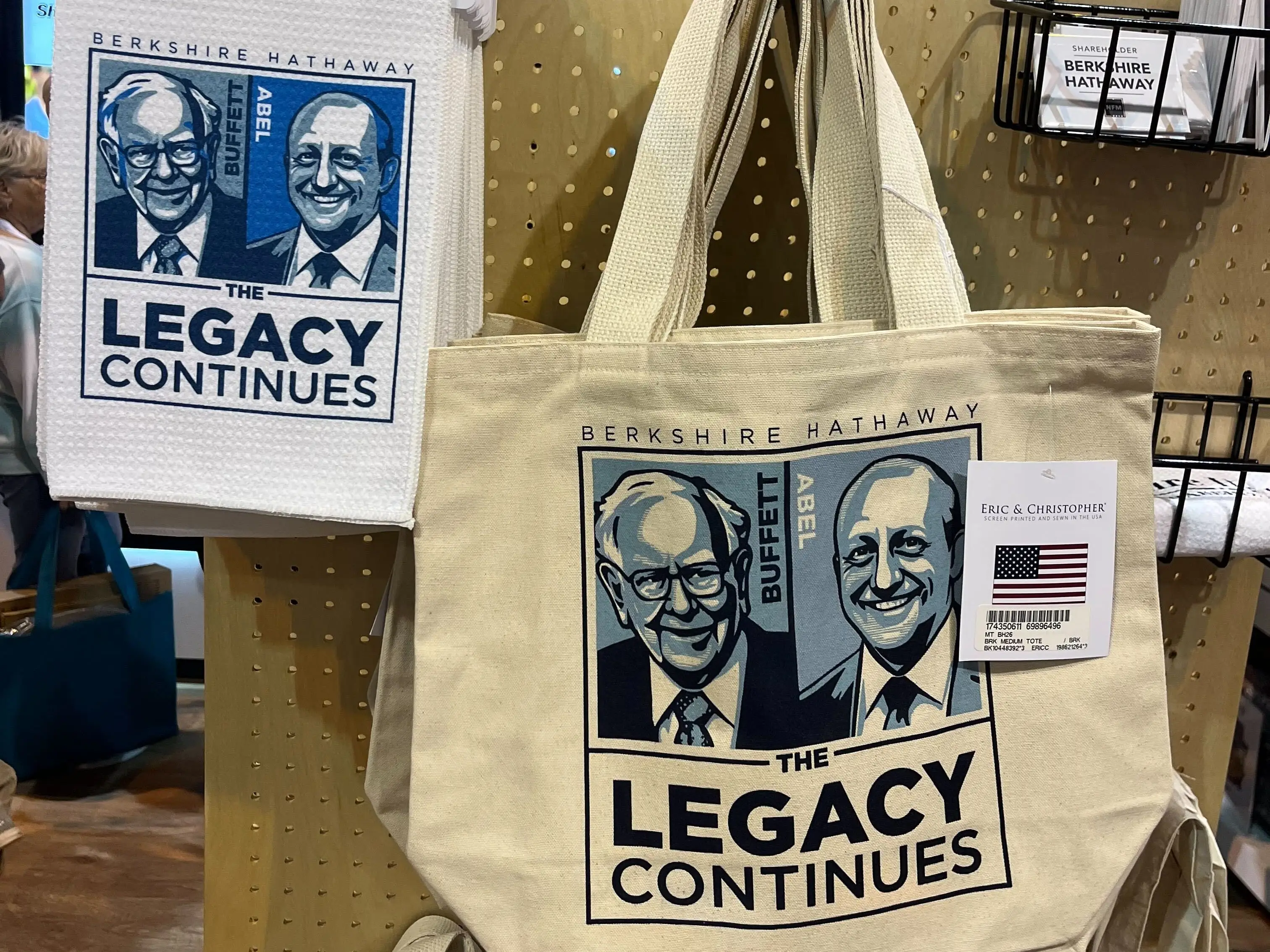 Warren Buffett and Greg Abel on a tote bag