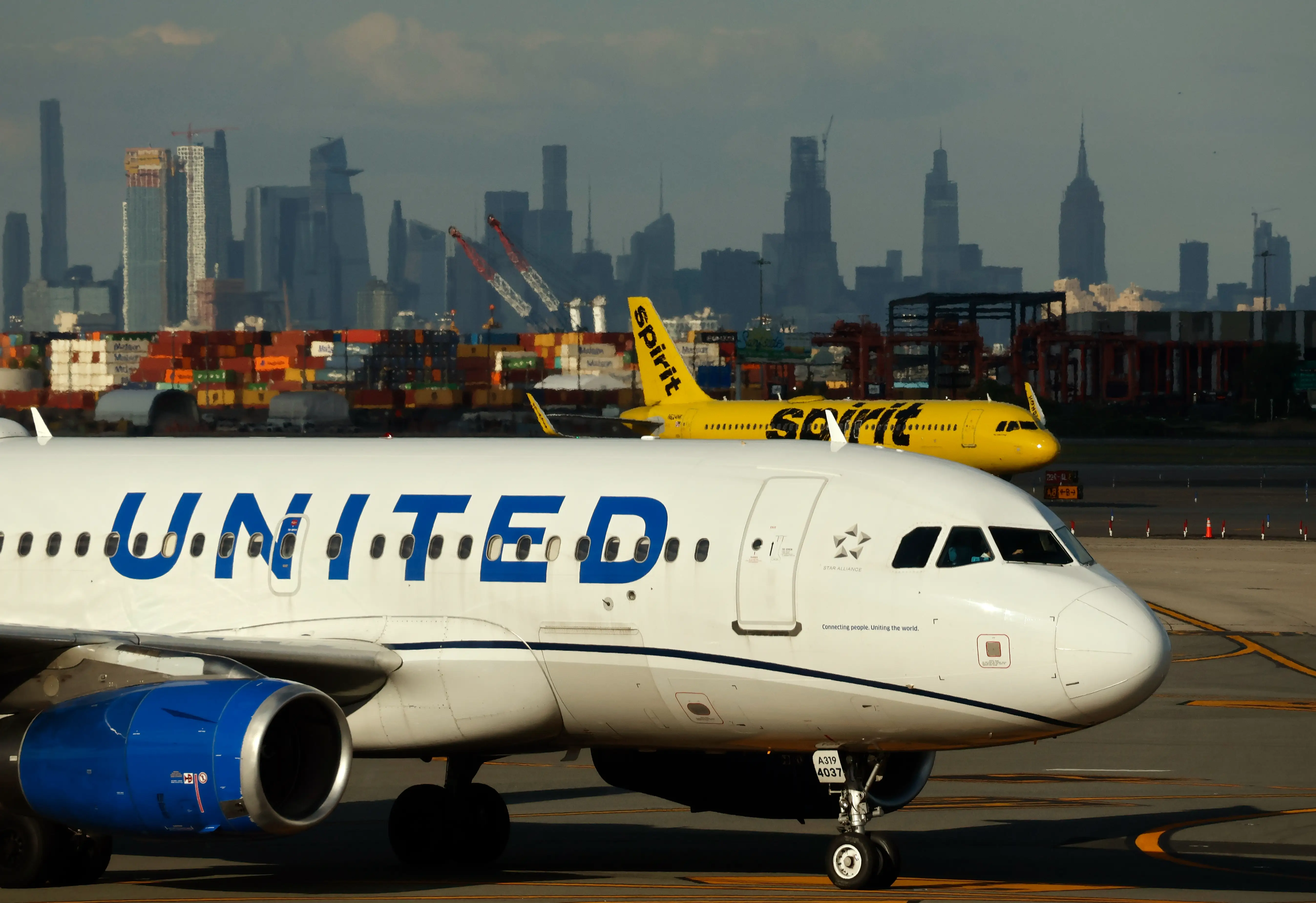 A United Airlines airplane and a Spirit Airlines airplane at Newark Liberty International Airport, New Jersey.
