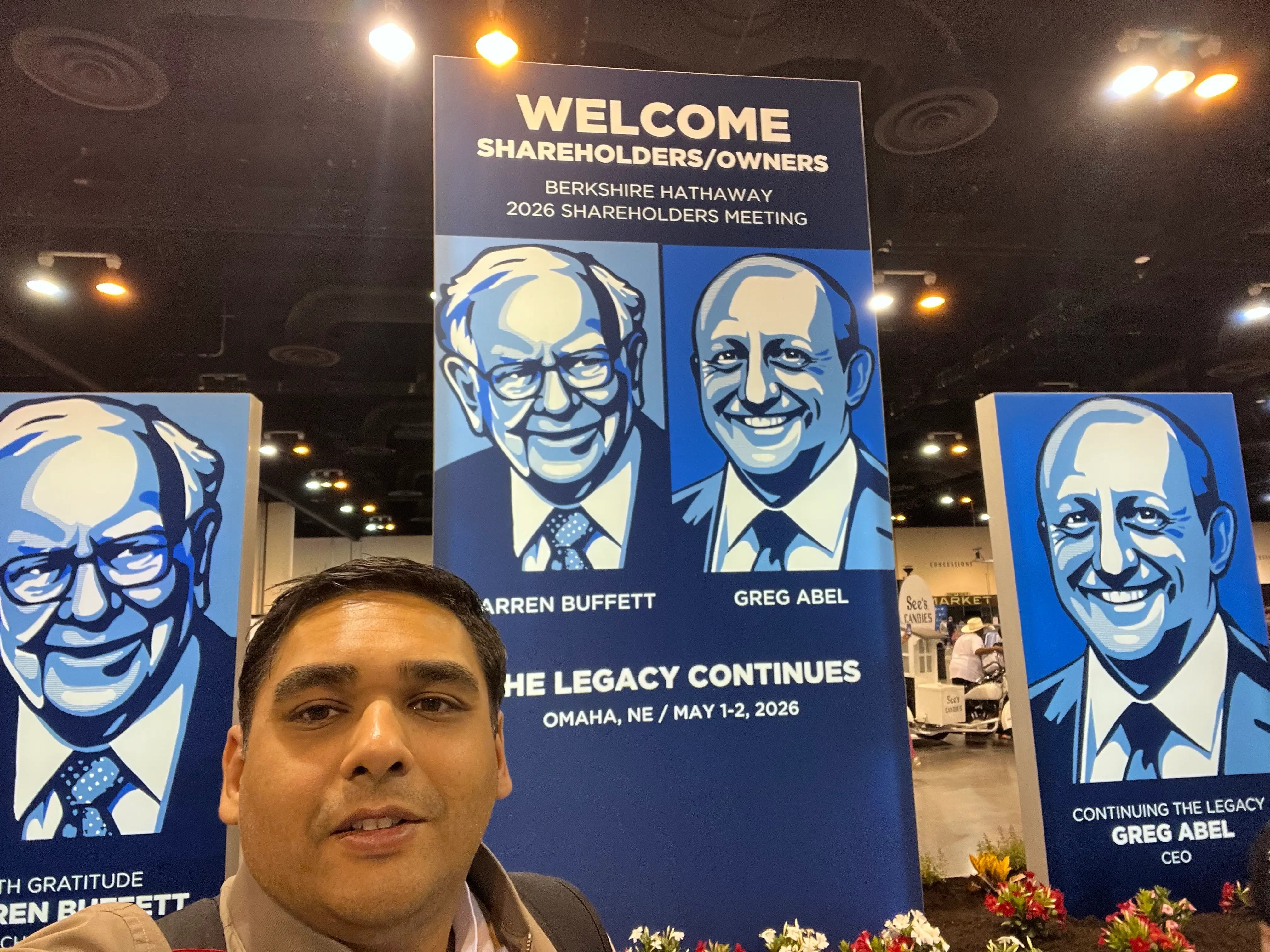 The author pictured in front of a welcome sign at Berkshire's meeting this year.