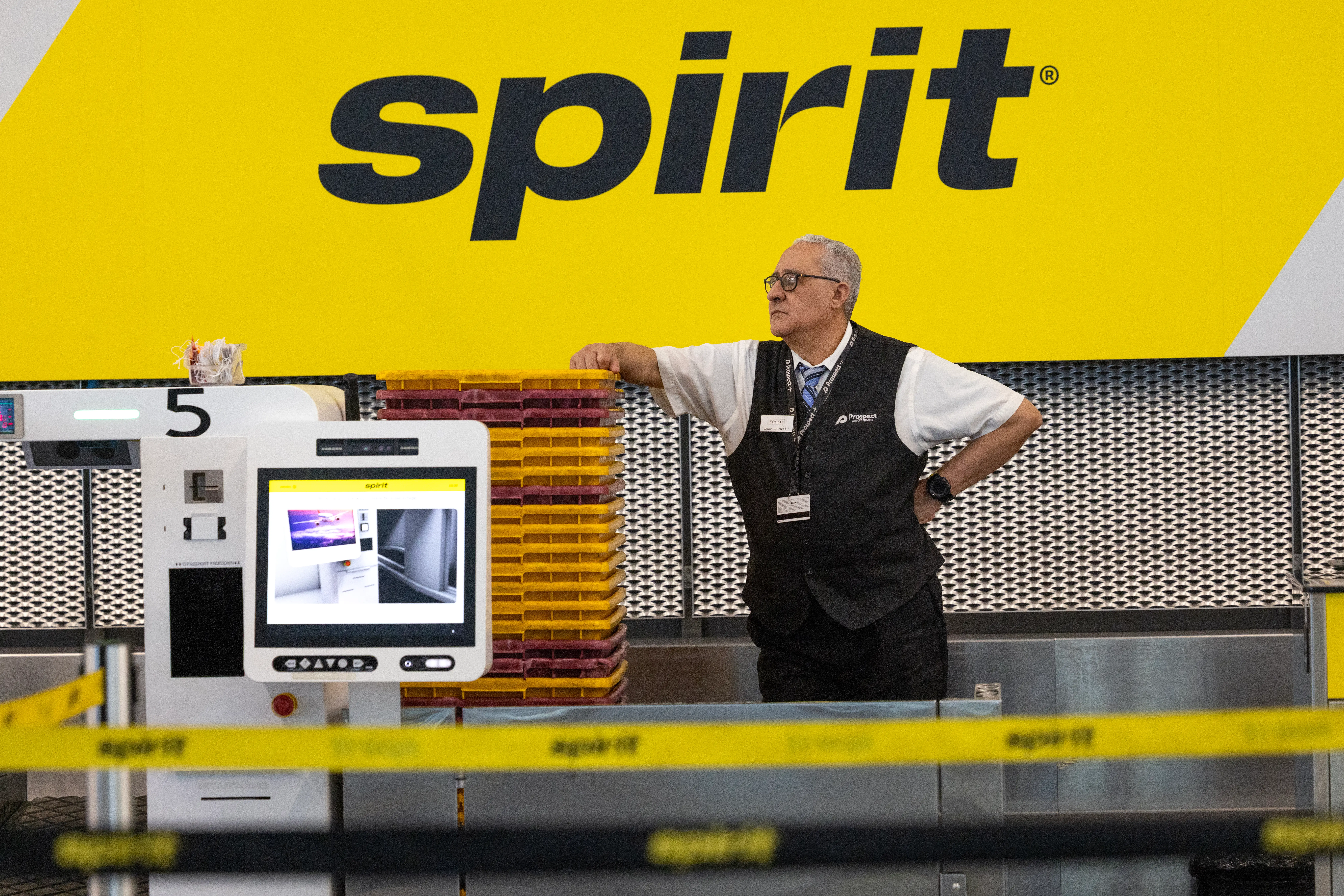 A Spirit Airlines worker at the ticket counter.